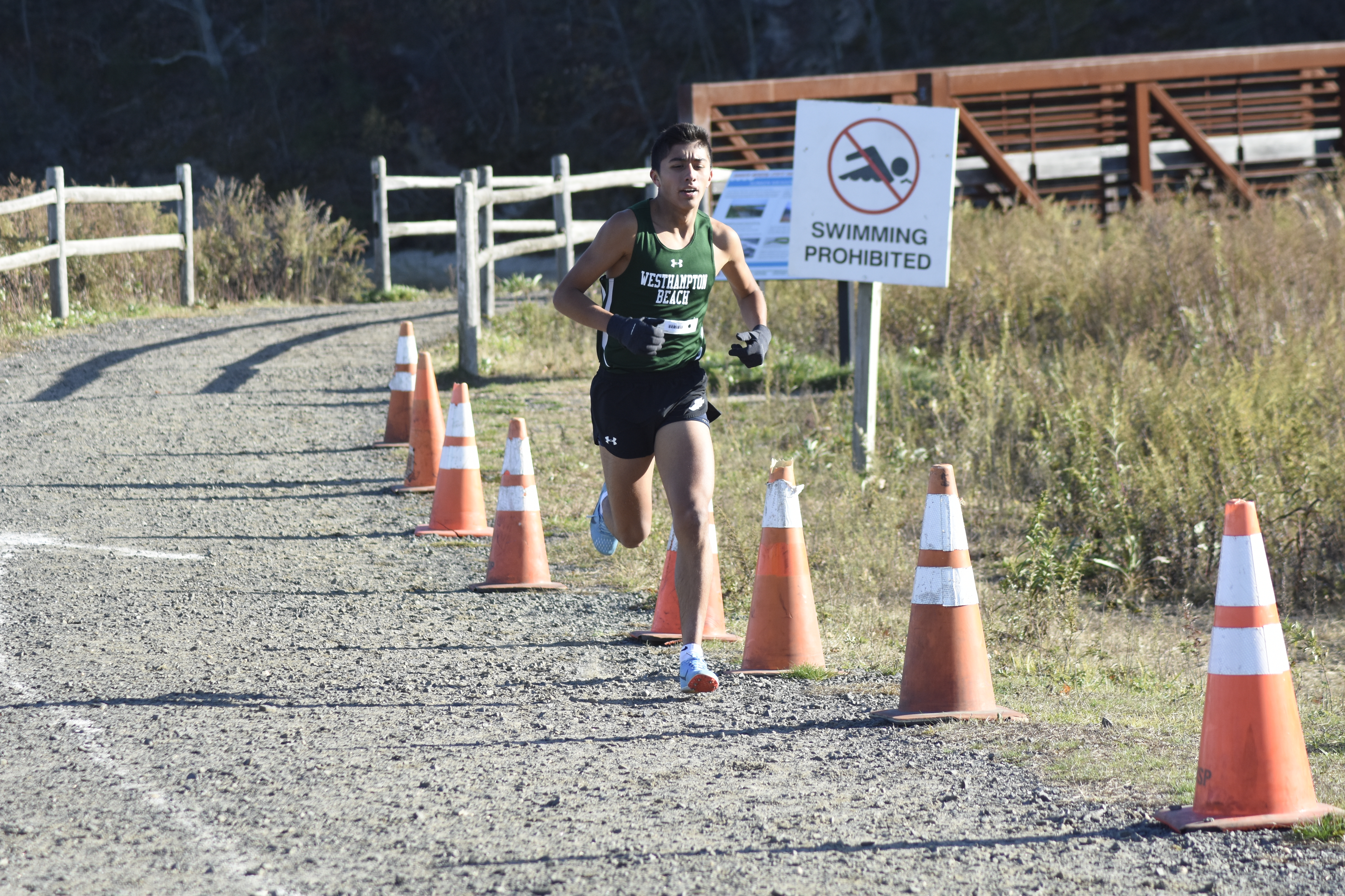 Westhampton Beach senior Ermel Bautista shaved 20 seconds off his time from a week ago at Divisions.