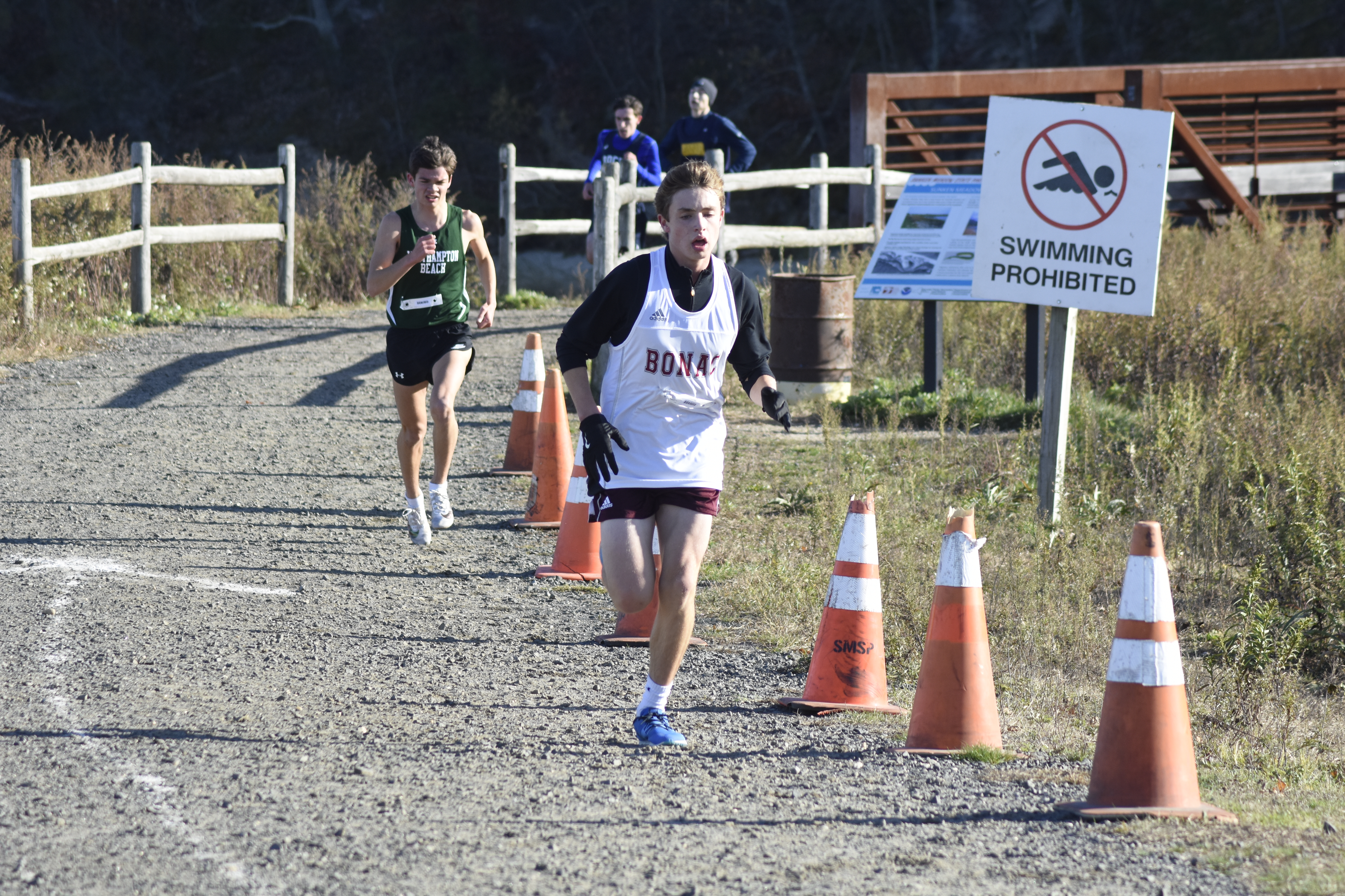 East Hampton sophomore Evan Masi heads toward the finish line.