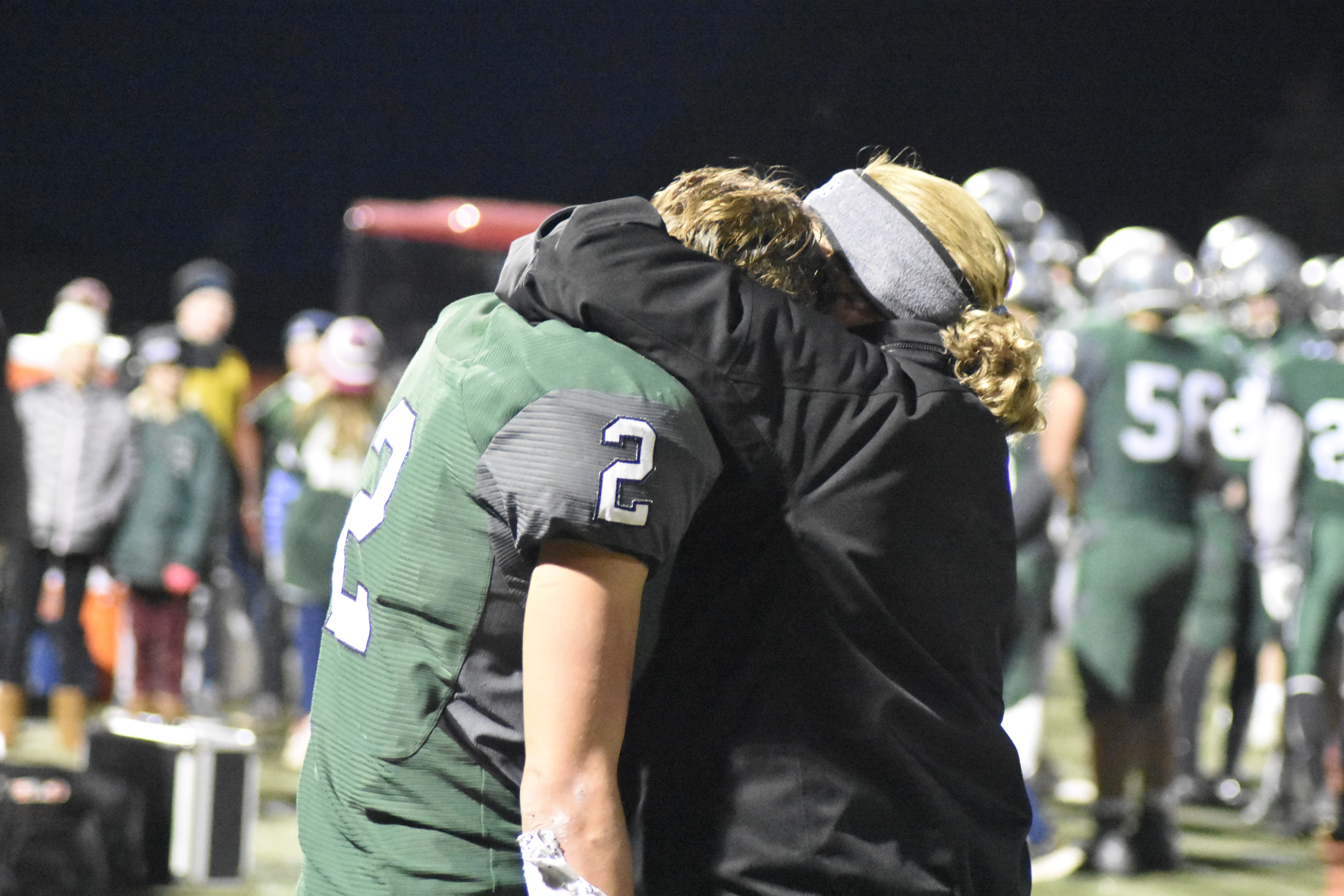 Westhampton Beach Athletic Director Kathy Masterso consoles senior Jaden AlfanoStJohn in the waning minutes of Friday night's game.