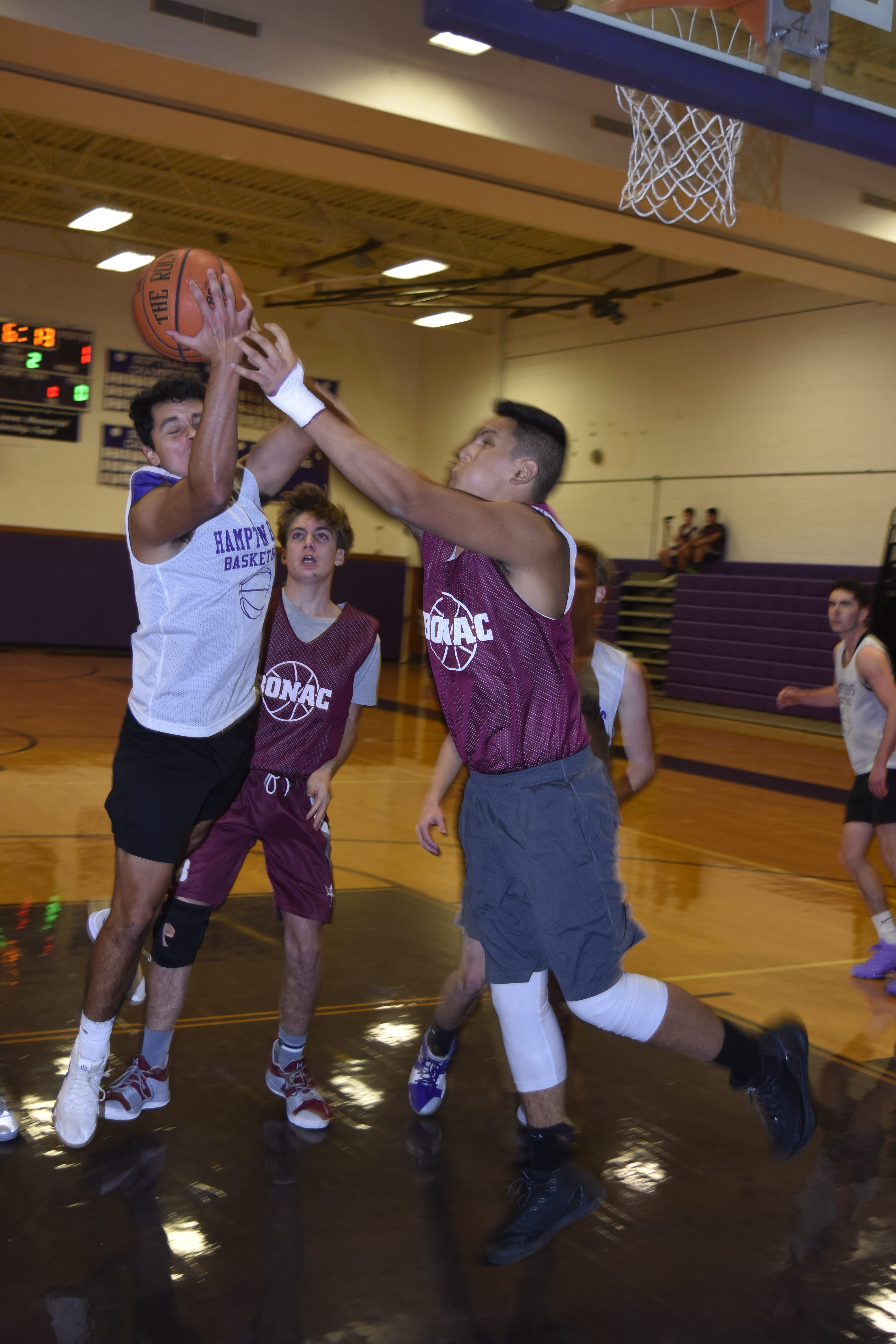 Jonathan Salas of Hampton Bays tries to grab a rebound during last week's scrimmage with East Hampton.