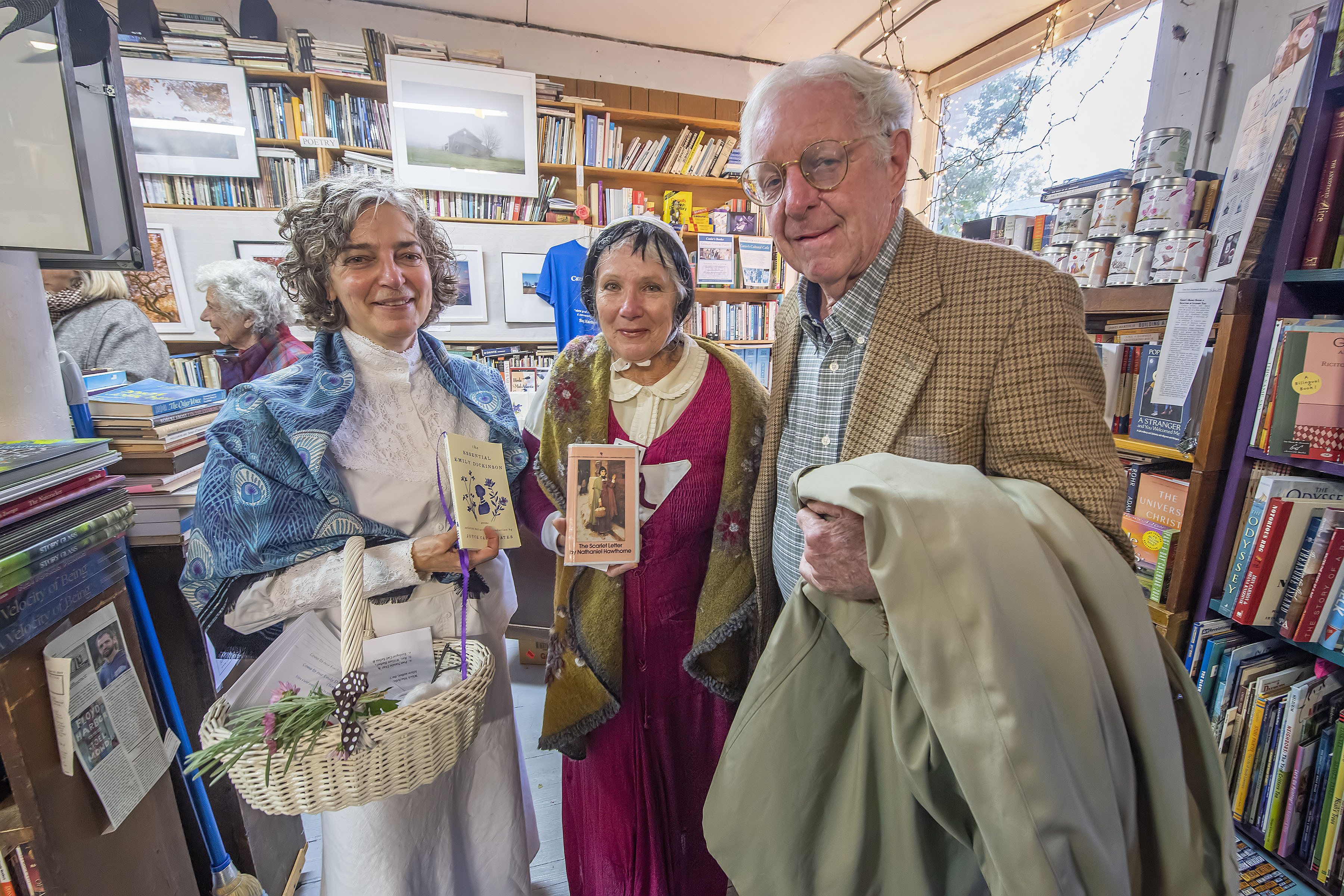 Maryann Calendrille (aka Emily Dickenson), Andrea Pisacano (aka Hester Prynne from The Scarlet Letter) and Peter Hansen during a Come-As-Your-Favorite-Author Halloween Party at Canio's Bookstore on Saturday night.  MICHAEL HELLER