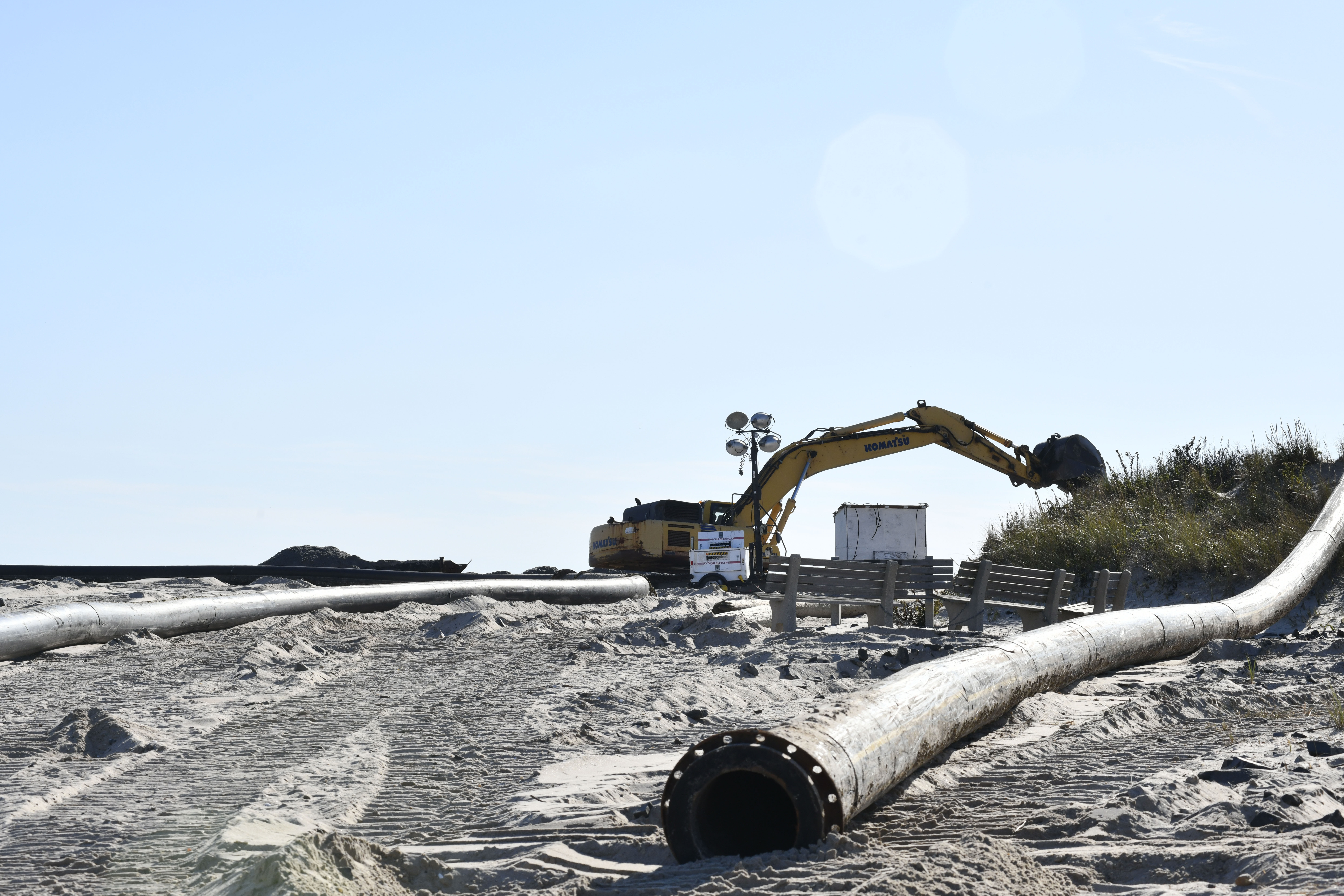 Crews have begun work on emergency dredging to bolster the dunes just west of Shinnecock Inlet in Hampton Bays.  DANA SHAW