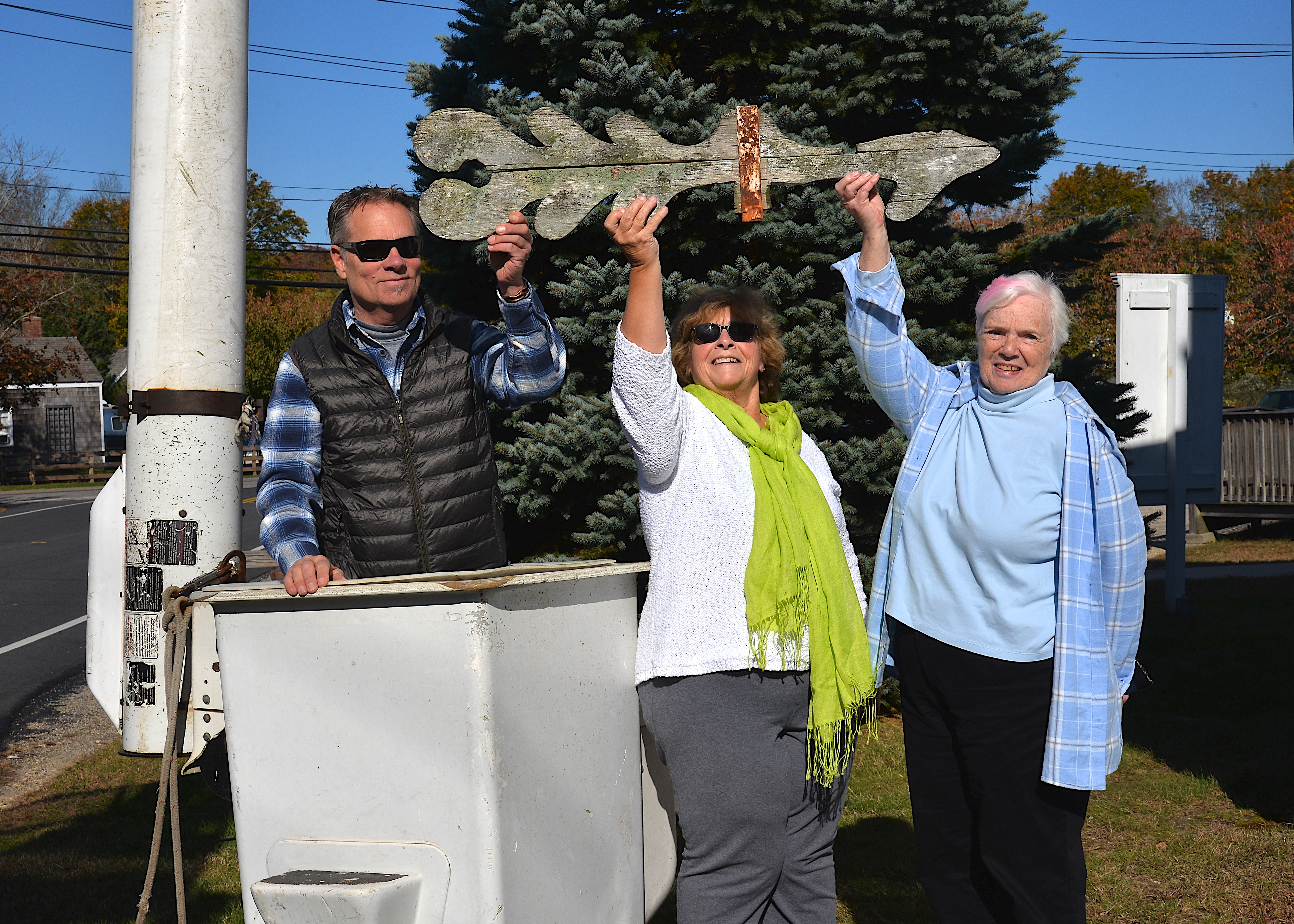 With assistance from Don Chambers of Timberworks who brought his cherry-picker, Ricky Muller removed the 137-year-old wooden windvane from the steeple of Springs Community Presbyterian Church on Sunday morning. A new windvane will be installed. KYRIL BROMLEY 