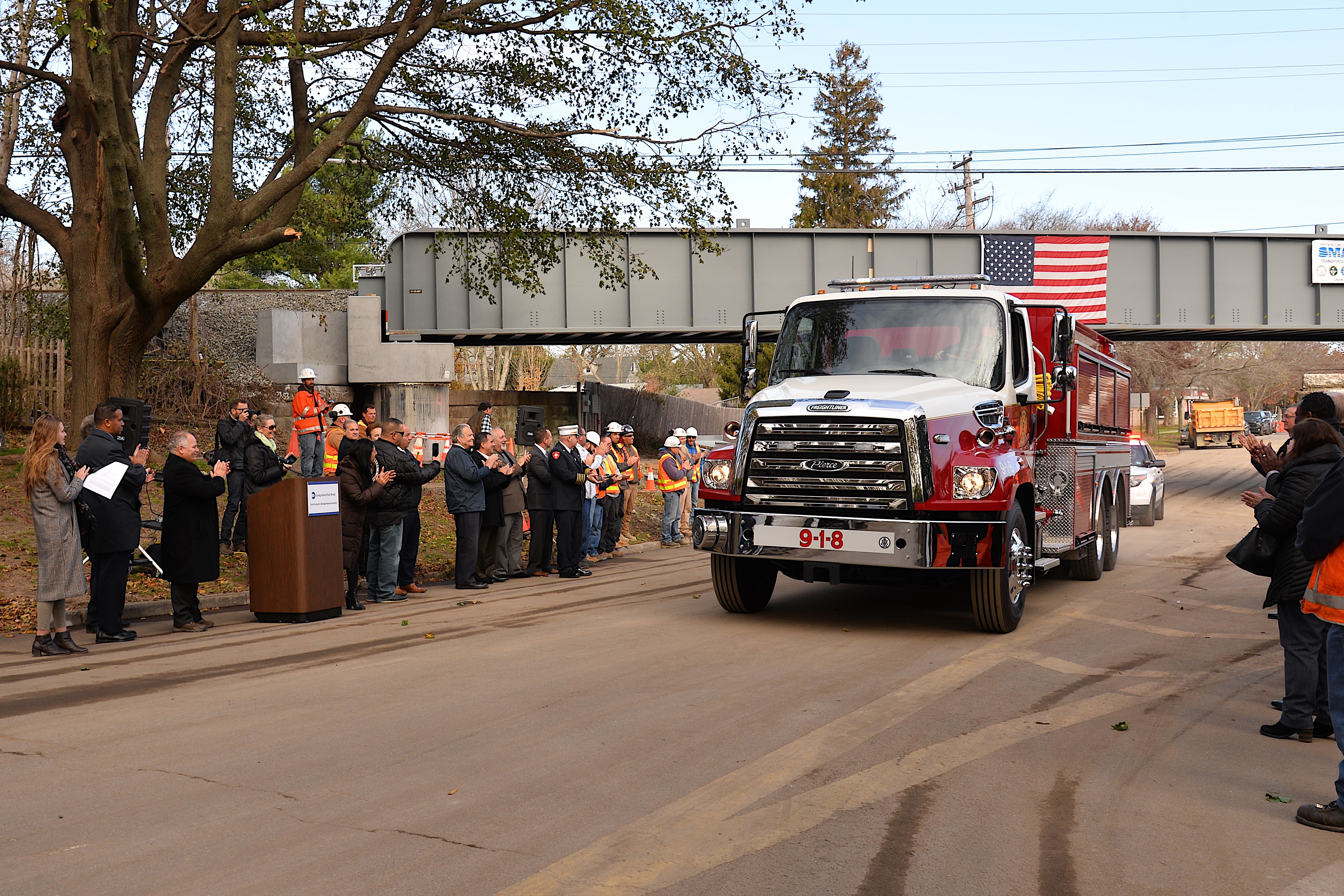 Instead of a ribbon cutting ceremony, a large fire truck was driven under the newly raised bridge.   KYRIL BROMLEY  