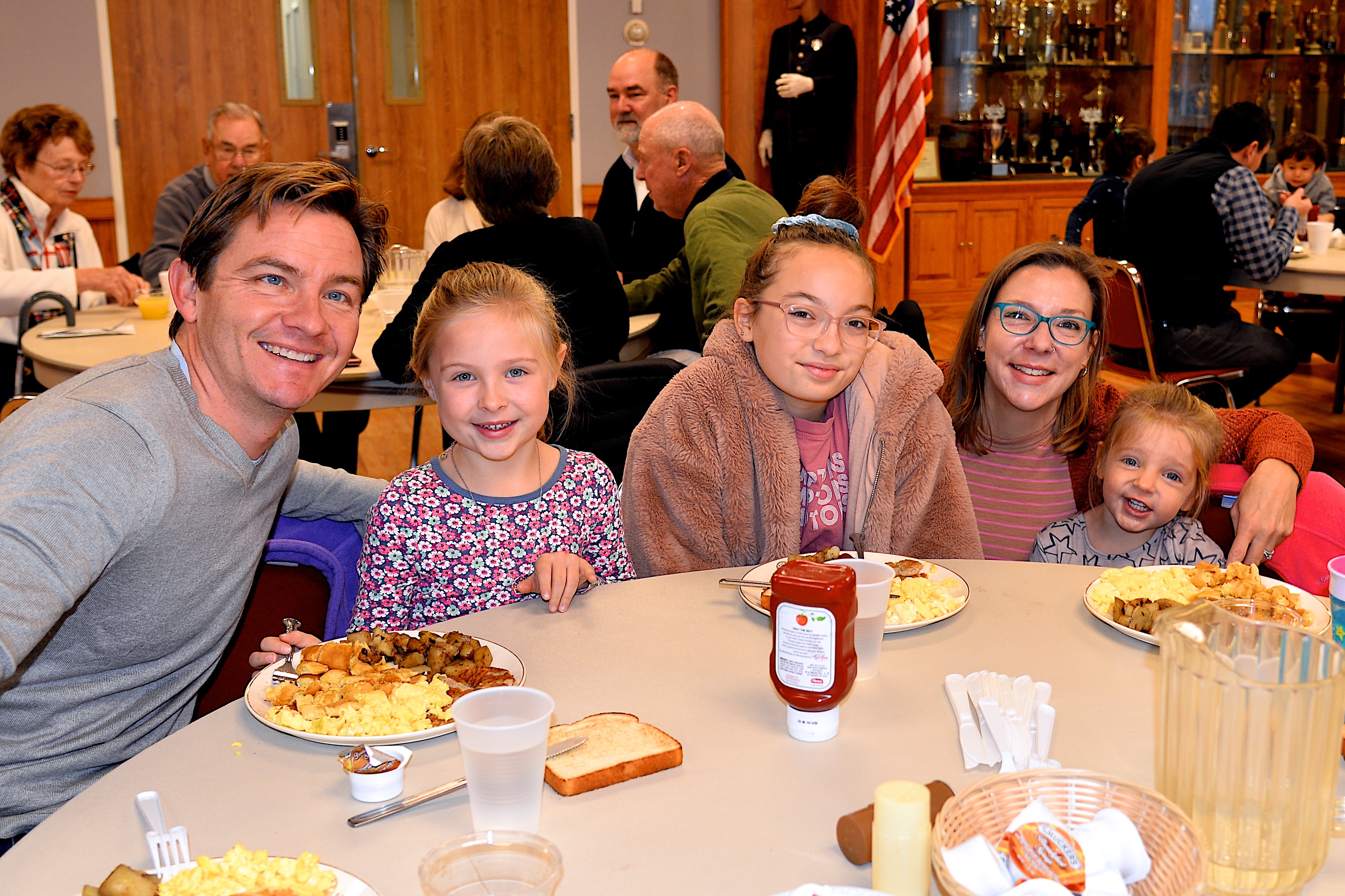 The East Hampton Fire Department hosted a pancake breakfast on Sunday, raising funds for the Eleanor Whitmore Early Childhood Center. Among those attended were members of the Feleppa family, from left, Alex, Fay, Ea, Jolie and Krissy.  KYRIL BROMLEY 