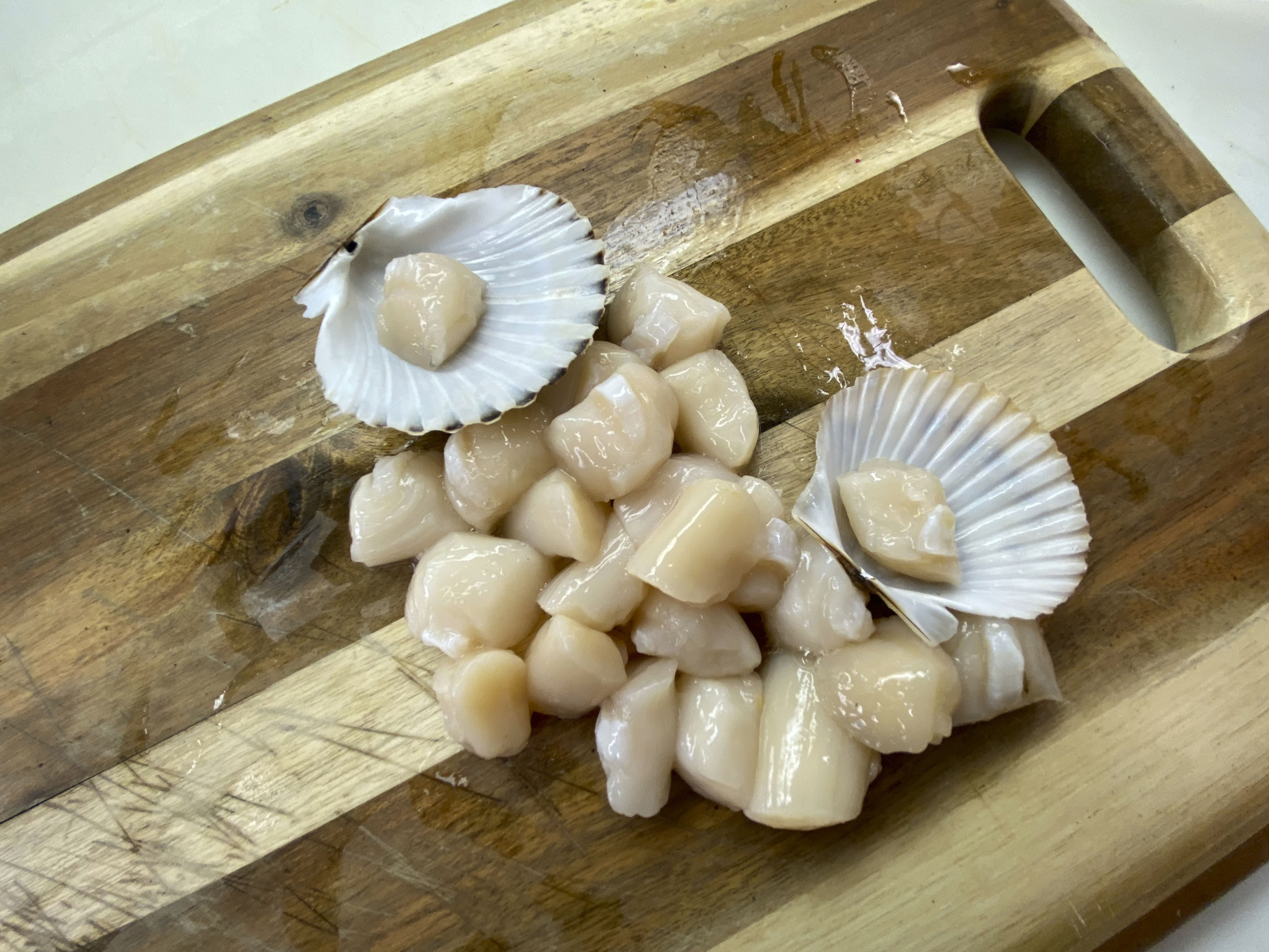 All that is left of the two bags of scallops that came into  Cor-J Seafood in Hampton Bays on Monday.  DANA SHAW