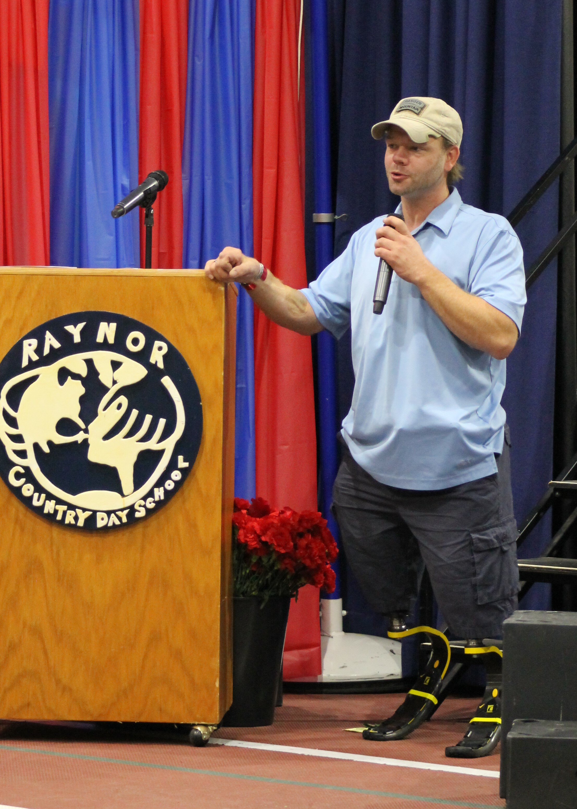 United States Army Veteran Christopher Levi addresses the students, staff, and fellow veterans gathered at Raynor Country Day School's annual Veterans Day ceremony. 
