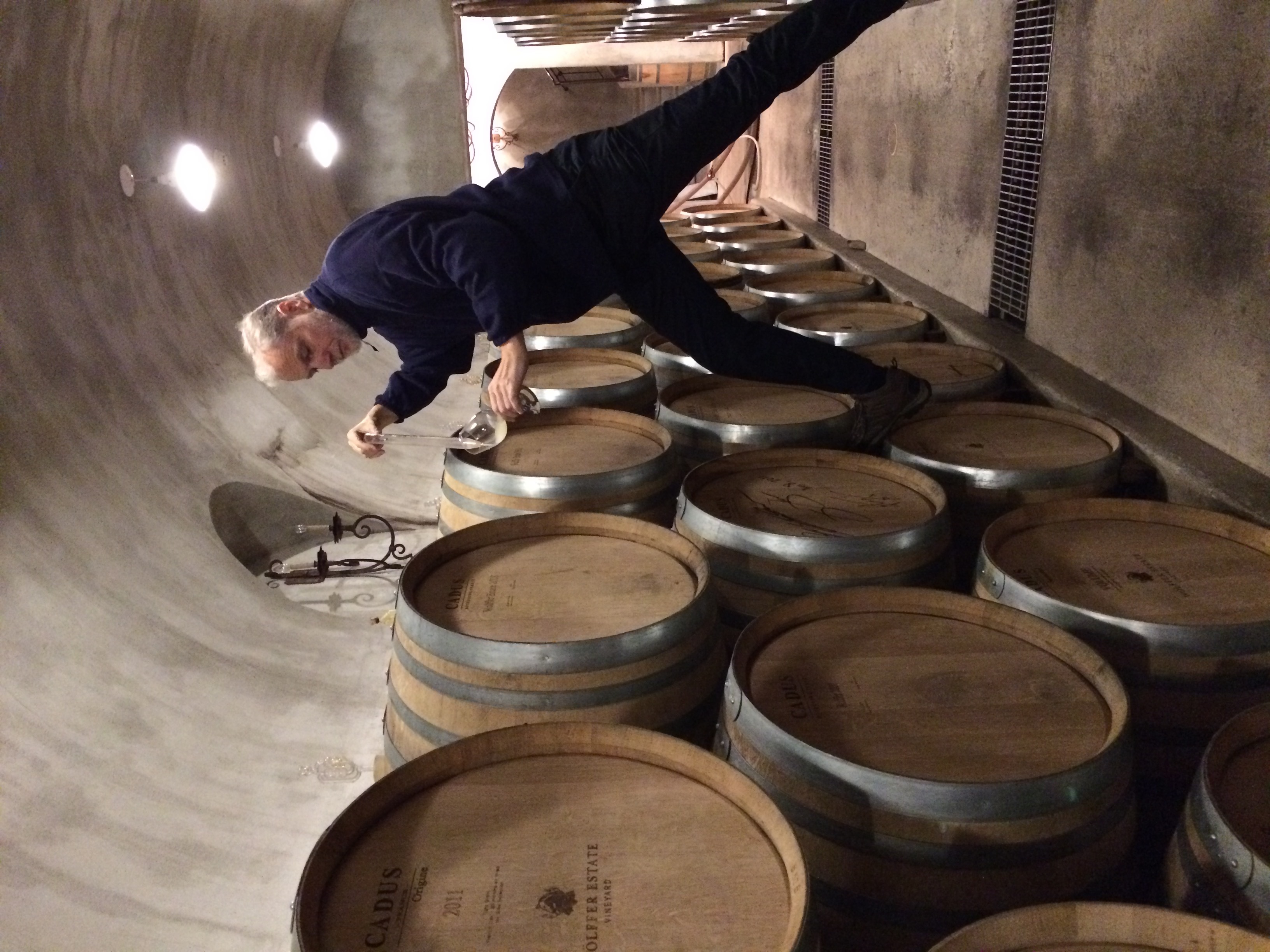 Roman Roth sampling from the barrels at Wolffer Estate Vineyard.