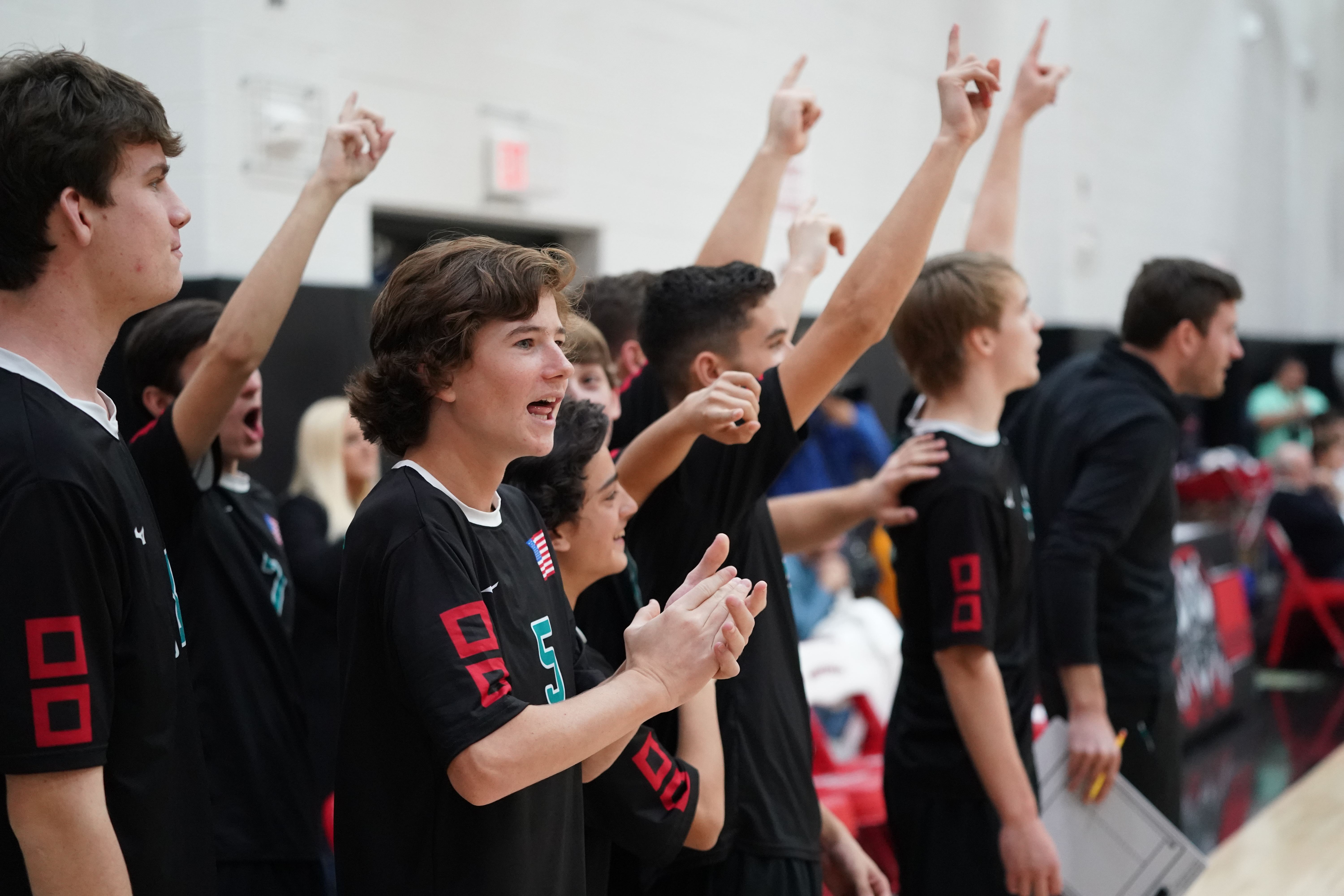 The 'Canes cheer on their teammates.