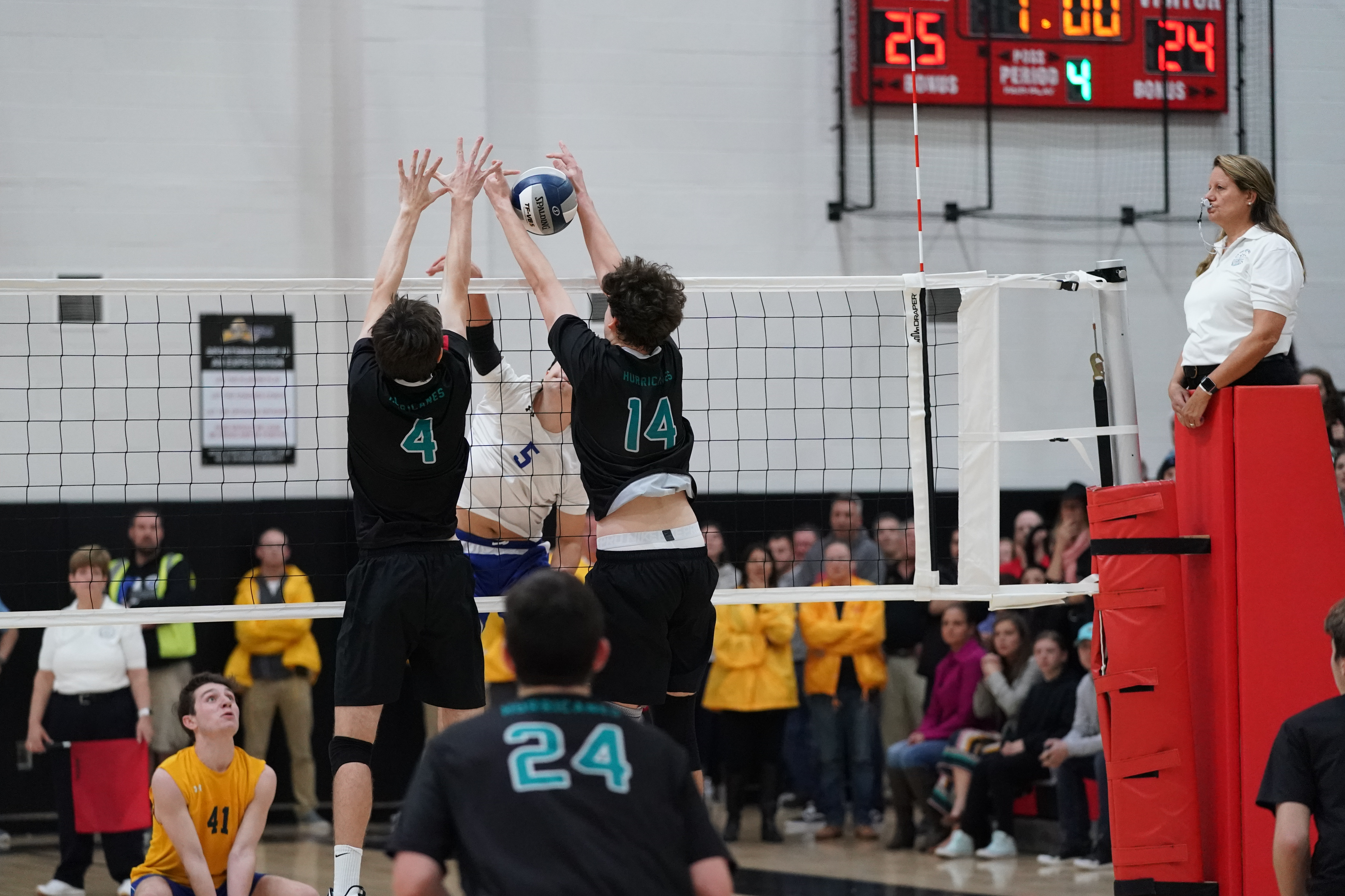 Luke Farnan (4) and Daniel Haber block Hauppauge's Chris Leone. 