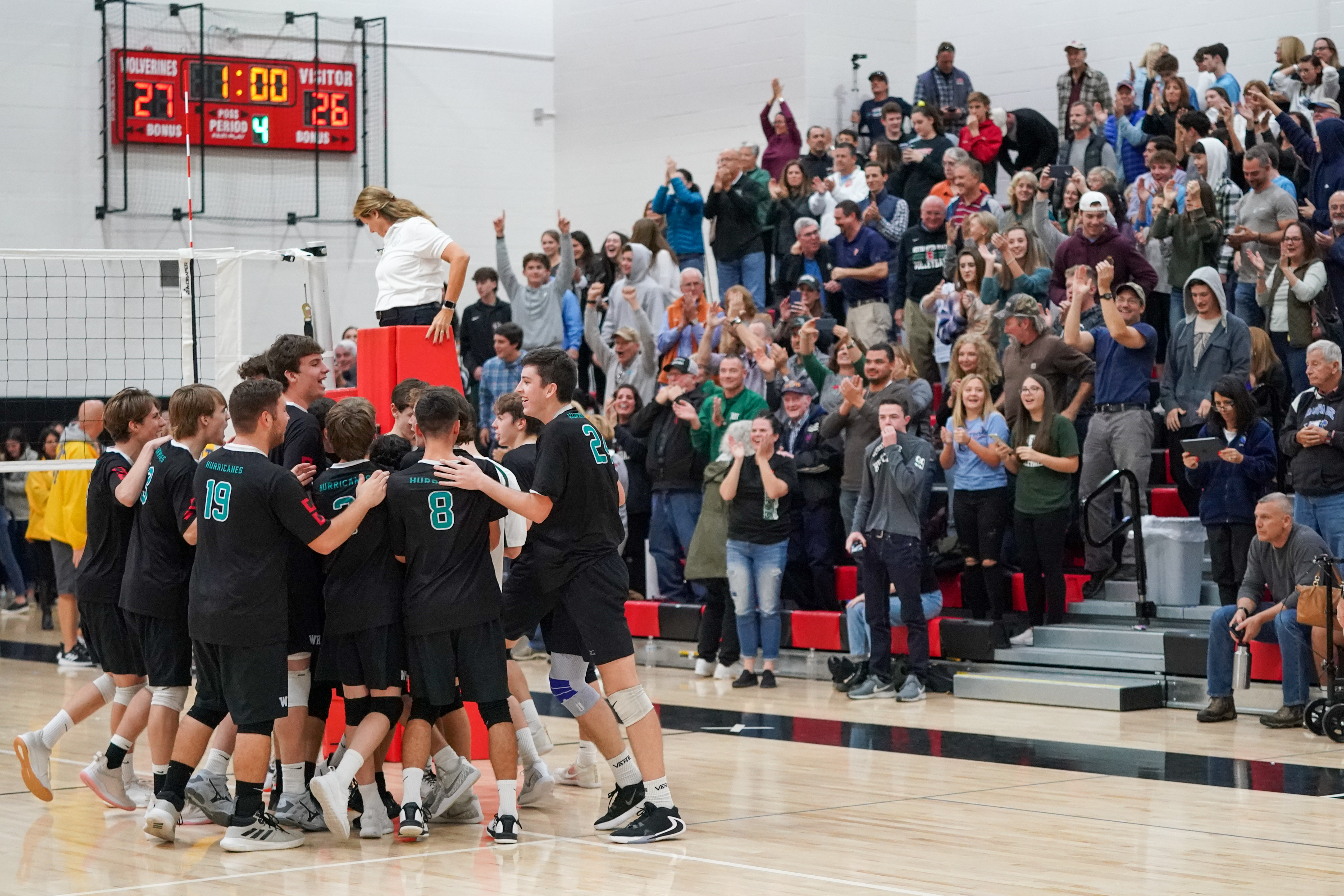 The Hurricanes celebrate their first ever county title while their crowd cheers them on.