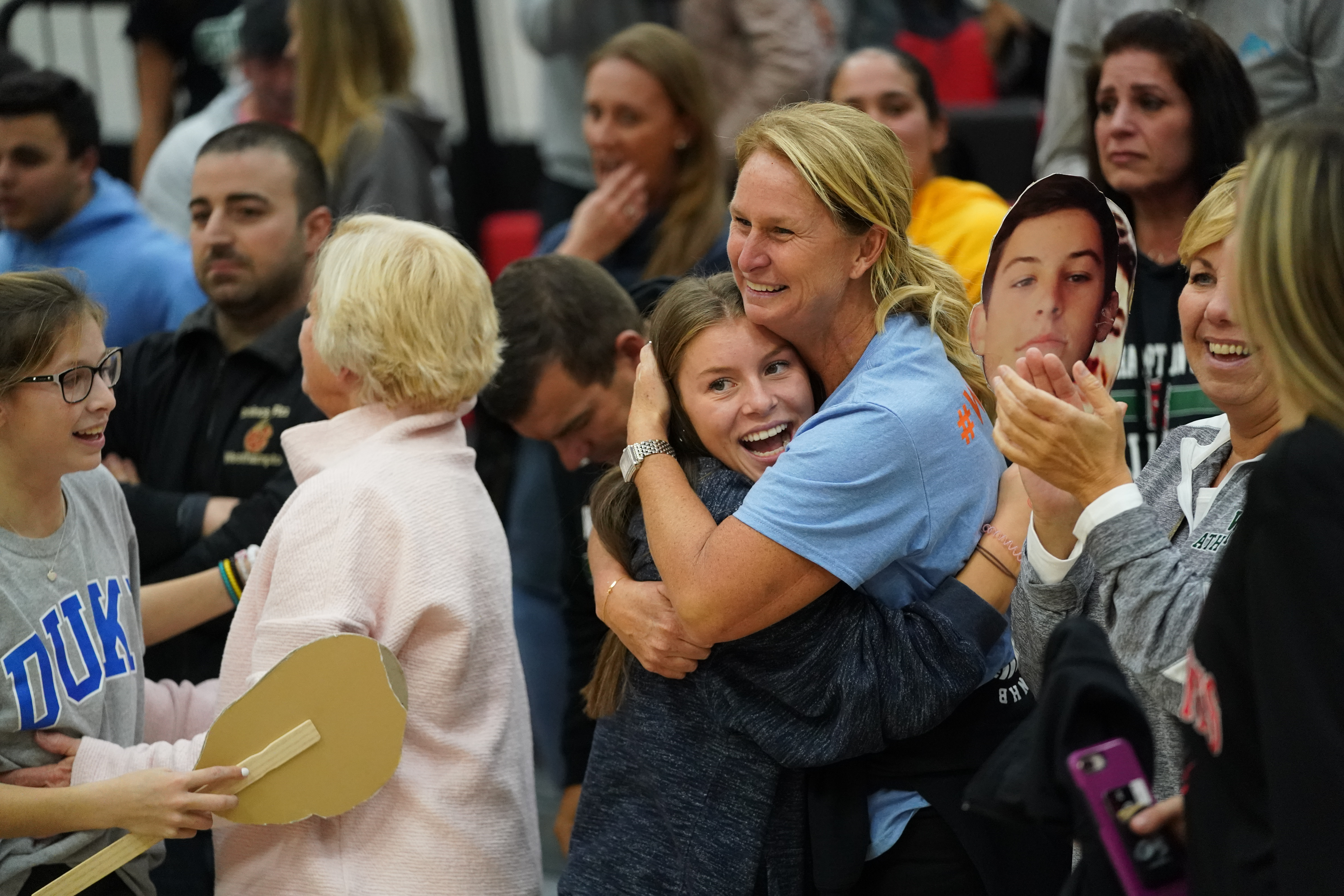 Friends and family of the players are all smiles after the big win.