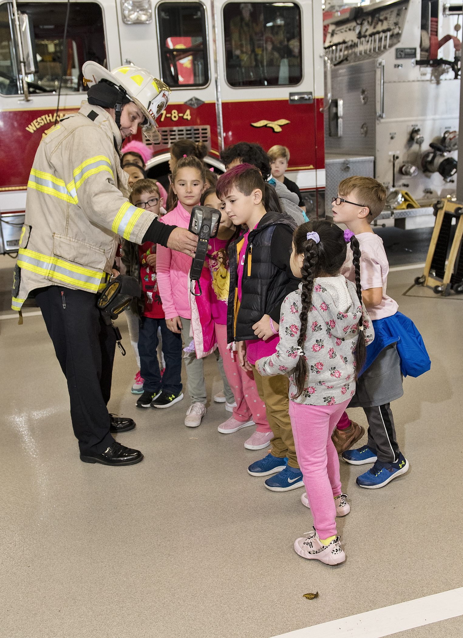 Second graders from the Westhampton Beach Elementary School visited the Westhampton Beach Fire Department’s firehouse on October 23. Third Assistant Chief Larry Saccente showed some of them how a thermal imaging camera works. Courtesy Westhampton Beach Fire Department.