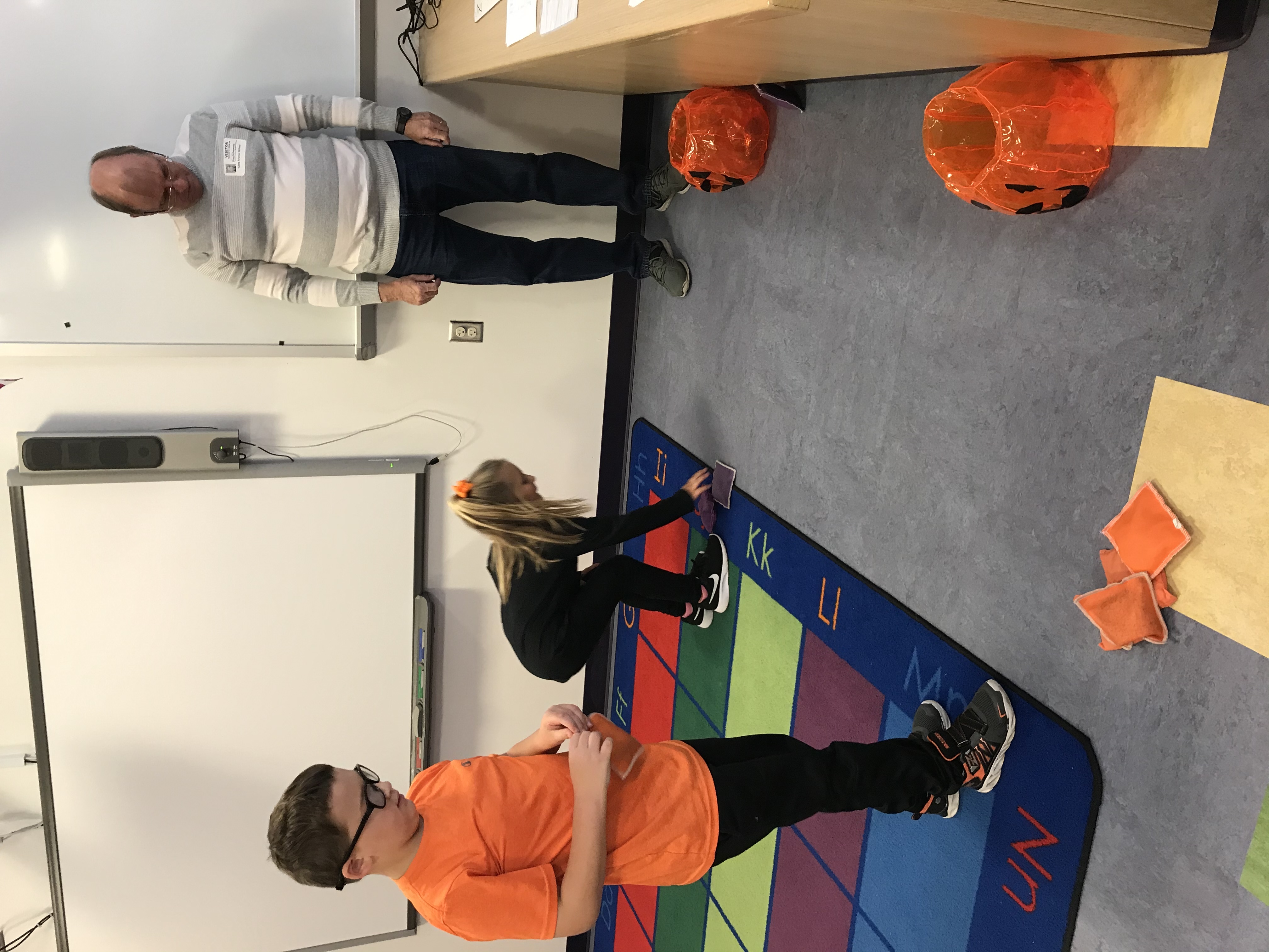 Tuttle Avenue Elementary students collecting data and creating art with their pumpkins. 
