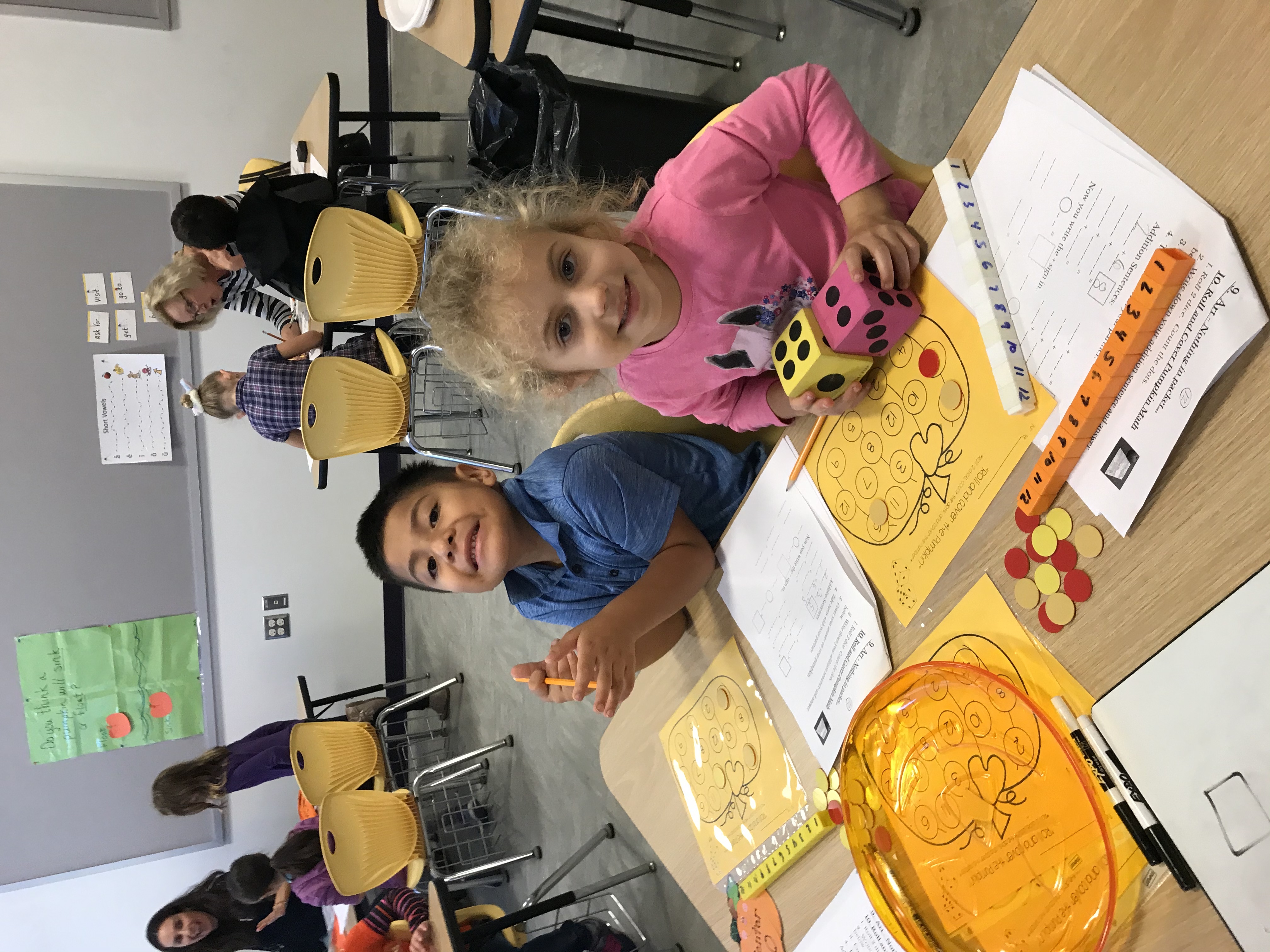 Tuttle Avenue Elementary students collecting data and creating art with their pumpkins. 