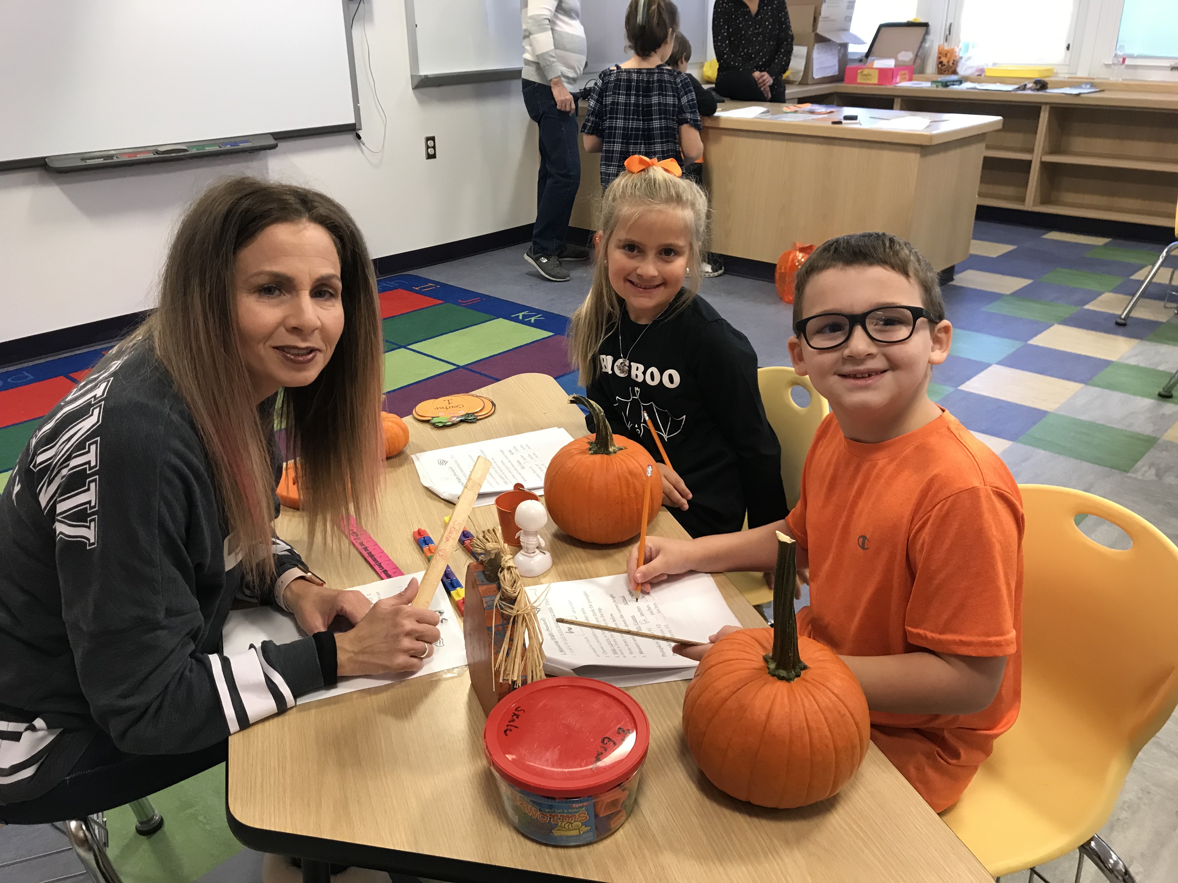 Tuttle Avenue Elementary students collecting data and creating art with their pumpkins. 