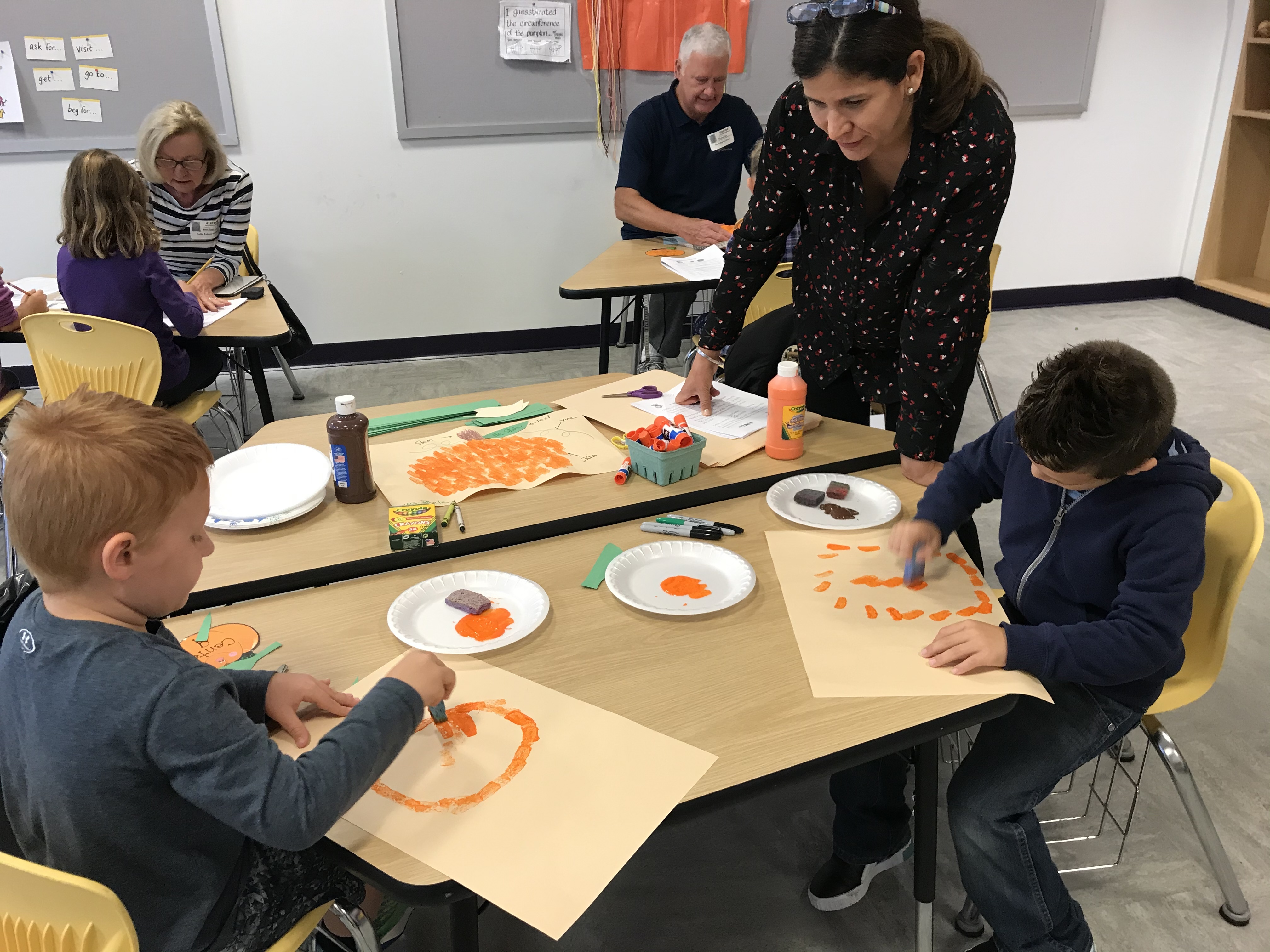 Tuttle Avenue Elementary students collecting data and creating art with their pumpkins. 