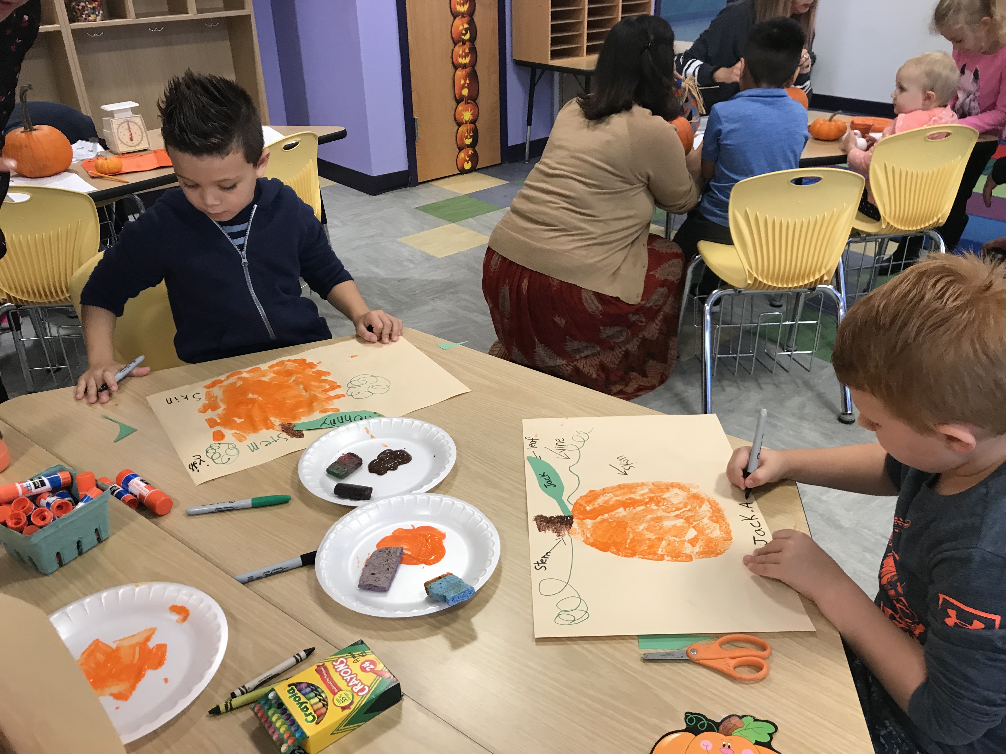 Tuttle Avenue Elementary students collecting data and creating art with their pumpkins. 