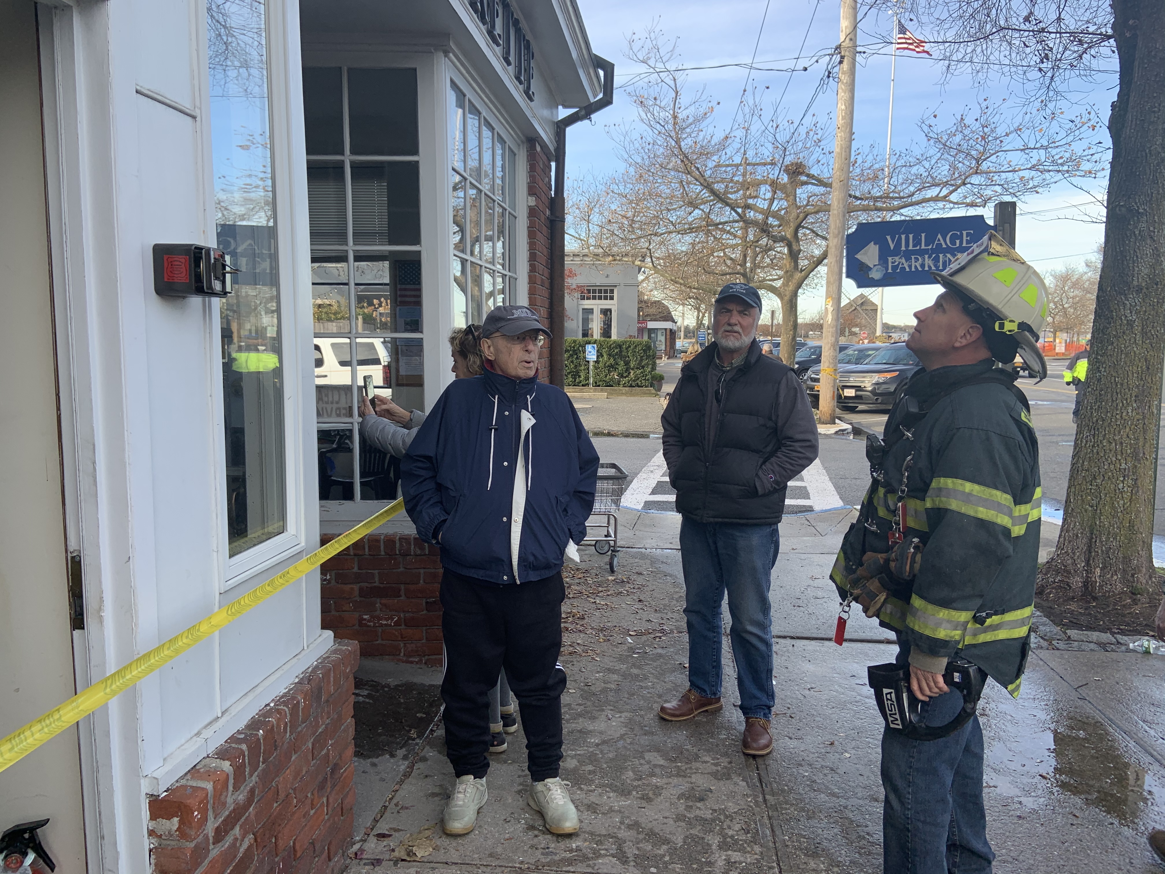 Building owner Ted Seiter talks with Sag Harbor Fire Department Police Chief Steve Miller. 