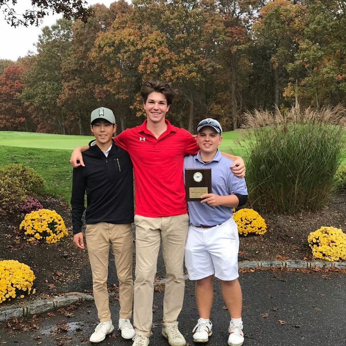 'Canes Mackenzie Kim and Cole Federico flank Pierson's Henry Brooks