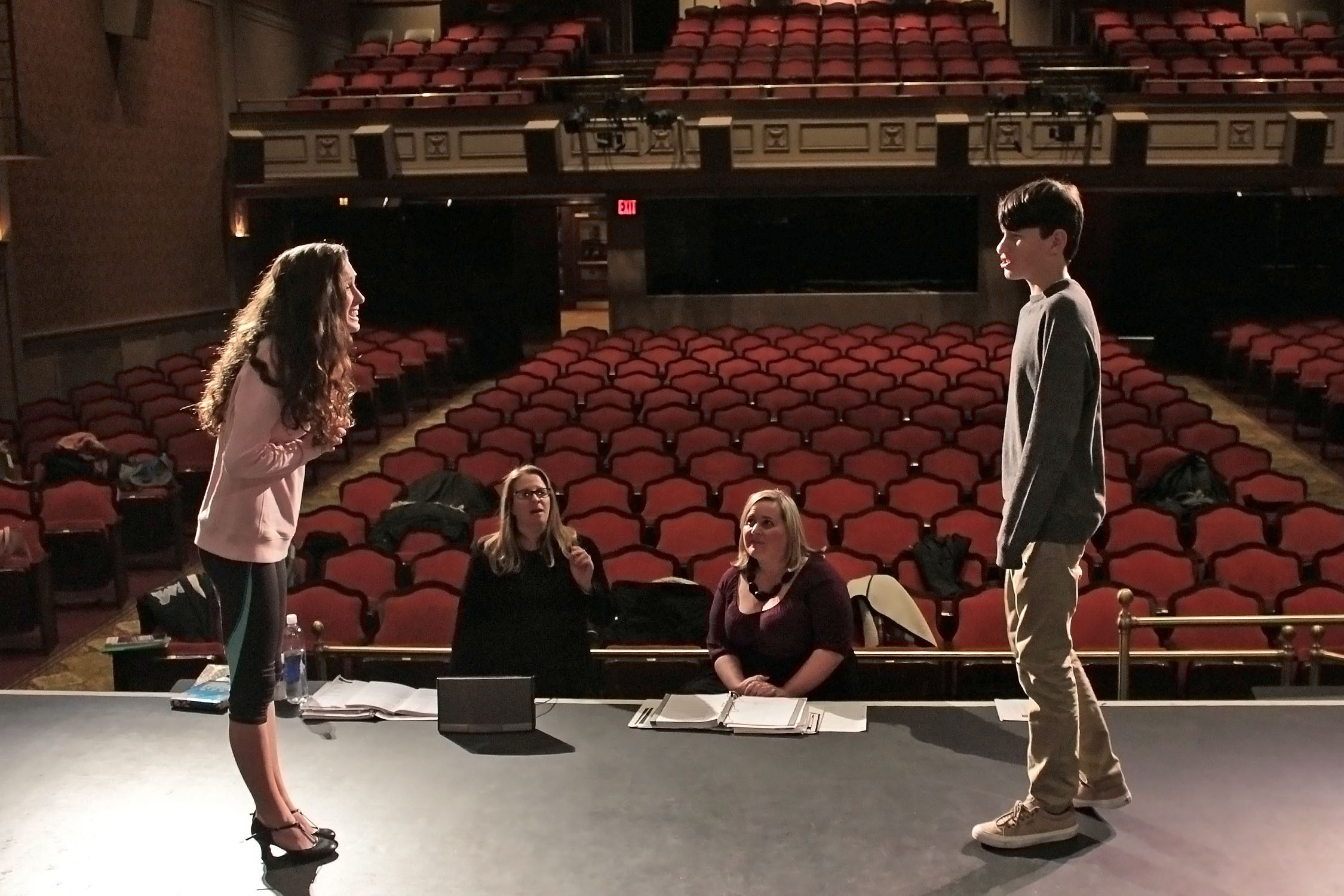 Julienne Penza-Boone, seated, right, directing young actors at Westhampton Beach Performing Arts Center in 2016.    PRESS FILE