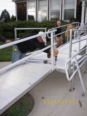 Members of the East Hampton Lions Club installing ramps for the disabled at their homes Bob Schaeffer