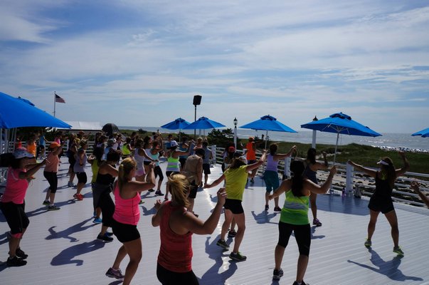 Oscar Gonzalez teaching his Zumba At The Beach class in Westhampton Beach. SUBMITTED PHOTO