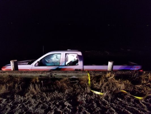 An elderly man drove a pickup truck into Mecox Bay from Flying Point Road on Thursday night. GREG WEHNER