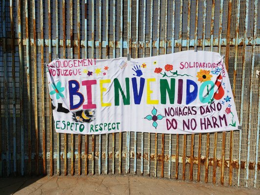 A welcome sign hung on the border wall. COURTESY LISA VOTINO-TARRANT