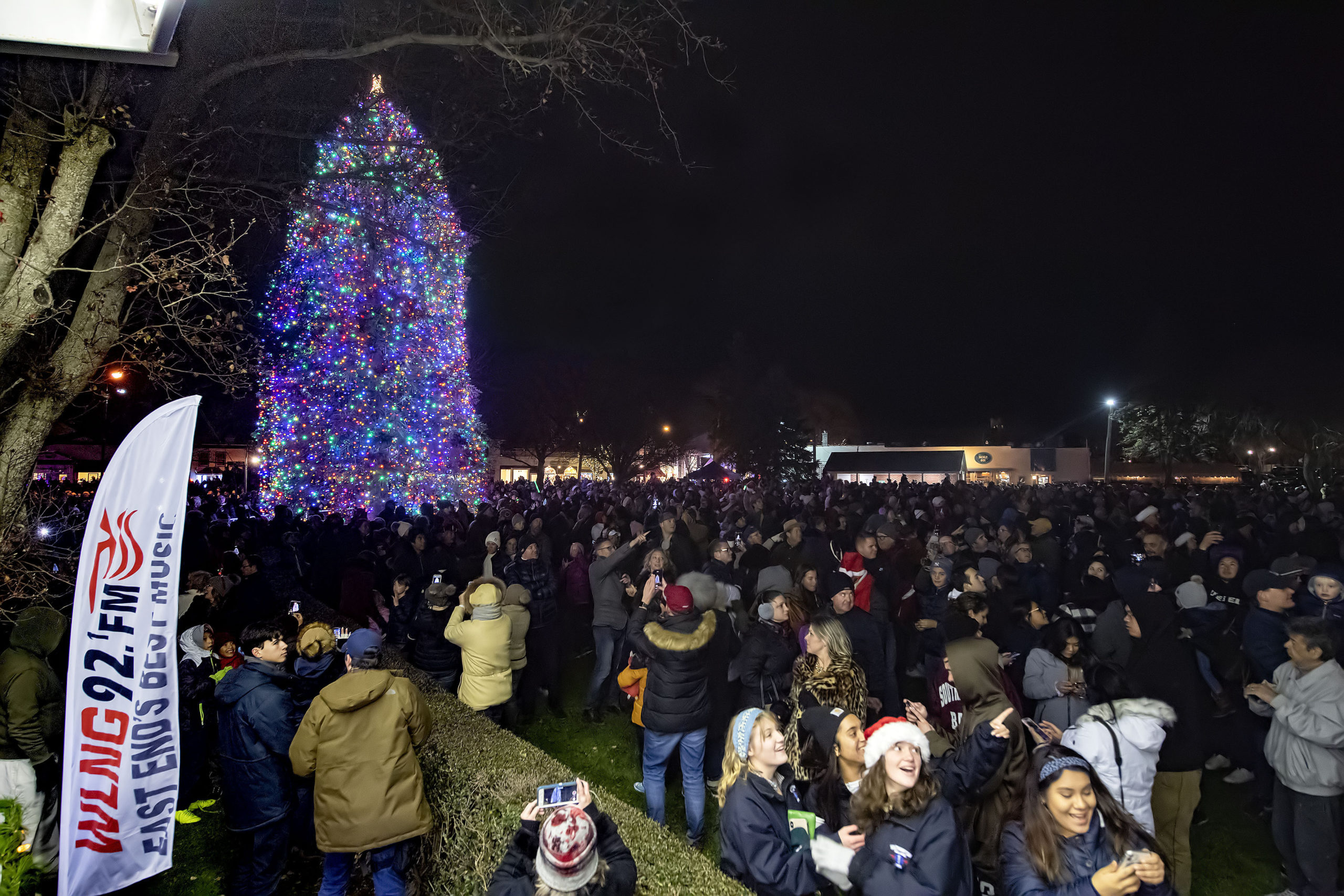 Thed crowd reacts as the fireworks begin during the Christmas Tree-Lighting Ceremony and Fireworks in Agawam Park following the 2019 