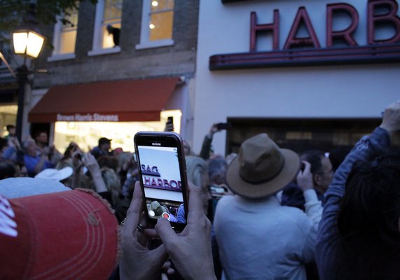 The crowd fills Main Street in Sag Harbor on Saturday evening for the lighting of the cinema sign.   TOM KOCHIE