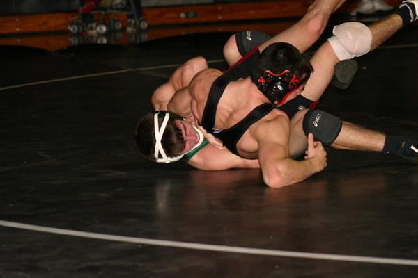 Pete Broccoli gets back points in his 14-2 win over Mustang Dan Carro at 126 pounds.