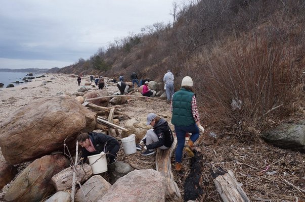 Volunteers pick up debris on 67 Steps Beach in Greenport. COURTESY ELI SURFRIDER FOUNDATION
