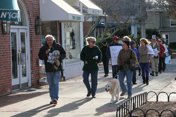  leads protesters through East Hampton Village on Saturday to demand an end to the village’s deer sterilization program. KYRIL BROMLEY