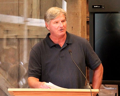 Chuck Weimar speaks at a Town Board meeting to address surf schools at Ditch Plains Beach. KYRIL BROMLEY