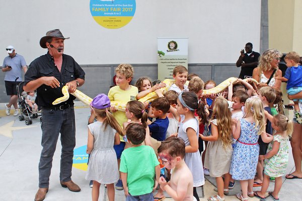 Jungle Bob and the kids hold a python.
