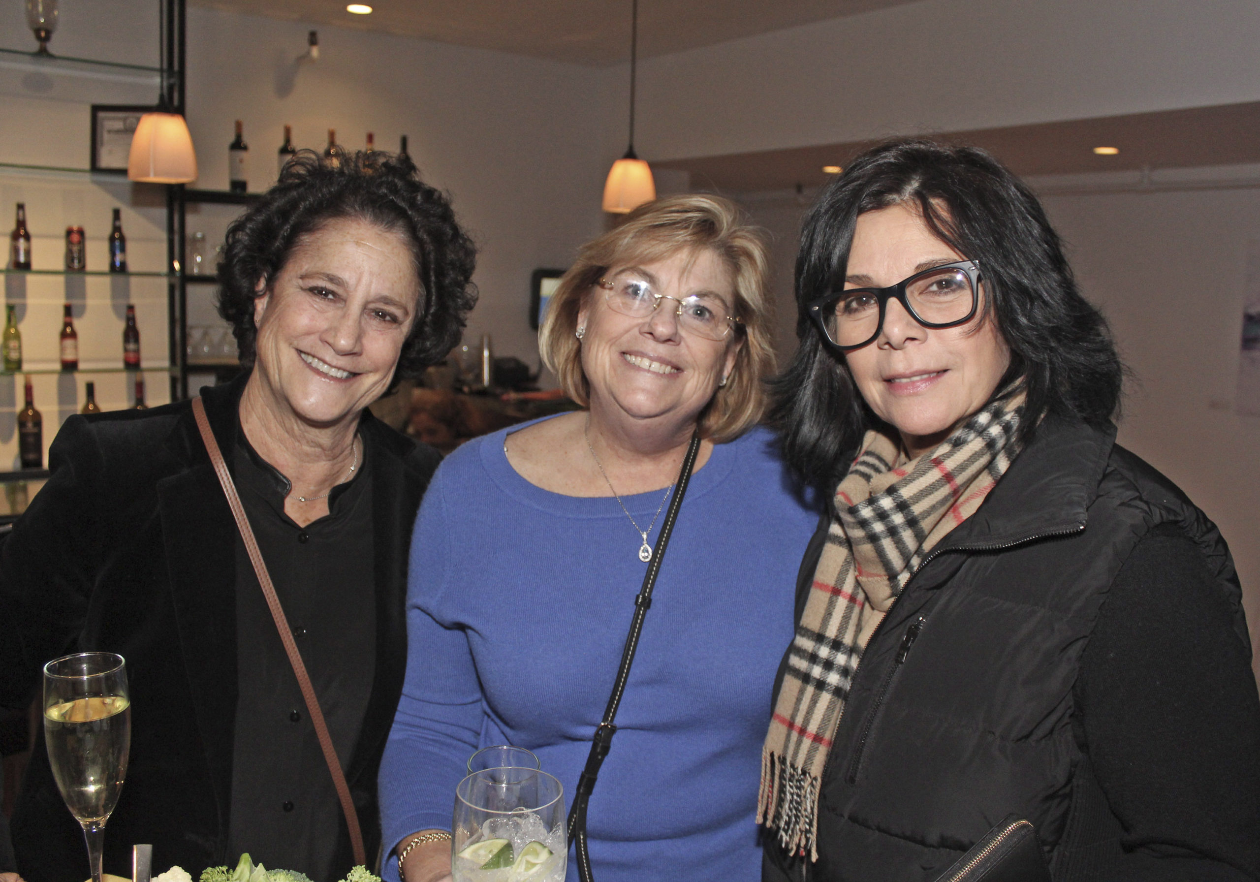 Elise Douglas, Sandy Griffin and Diane Vitale at the Maureen's Haven Homeless Outreach winter benefit on Saturday night at Seasons of Southampton. TOM KOCHIE