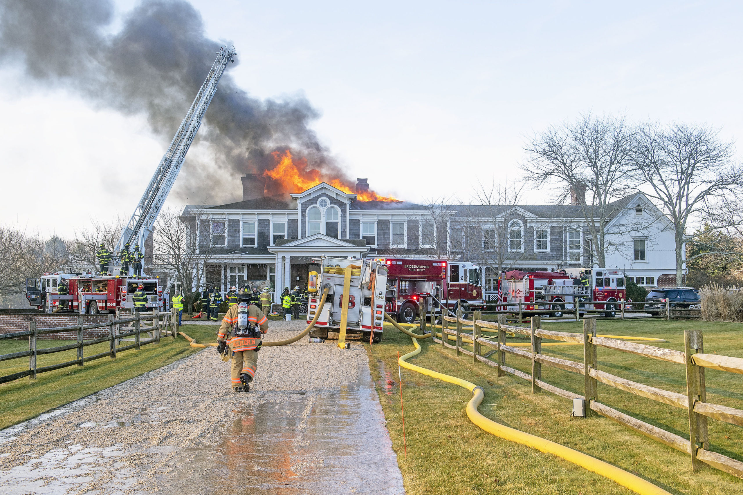 The Bridgehampton Fire Department, assisted by mutual aid from several other local fire departments, battled a   fire in the roof of a Water Mill mansion on Little Noyac Path in Water Mil on Saturday.