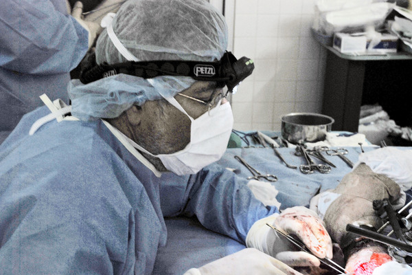 Dr. Medhat Allam performs surgery<br>Photo by Jon Levitsky