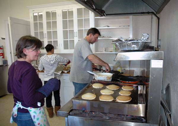 Theresa Quinn and Larry LaPointe work the grill at the Bridgehampton School Parent Teacher Organization pancake breakfast on Sunday. 