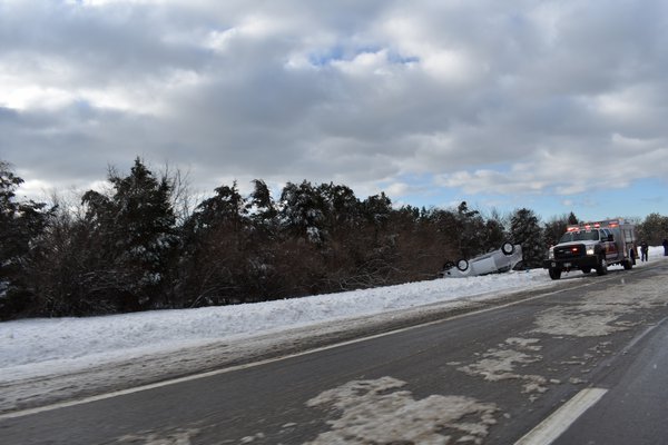 A vehicle driving eastbound on Sunrise Highway in Hampton Bays Friday morning left the roadway and overturned just past Exit 65N.