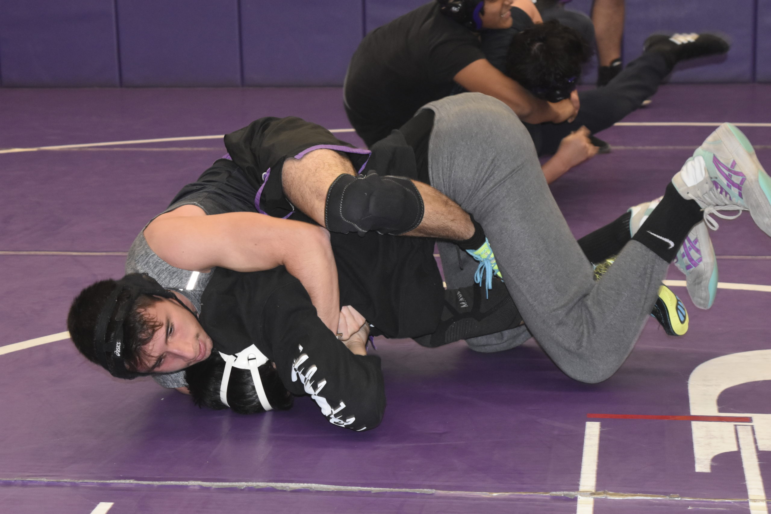 Nick Pacheco works with a teammate during a Saturday morning practice.