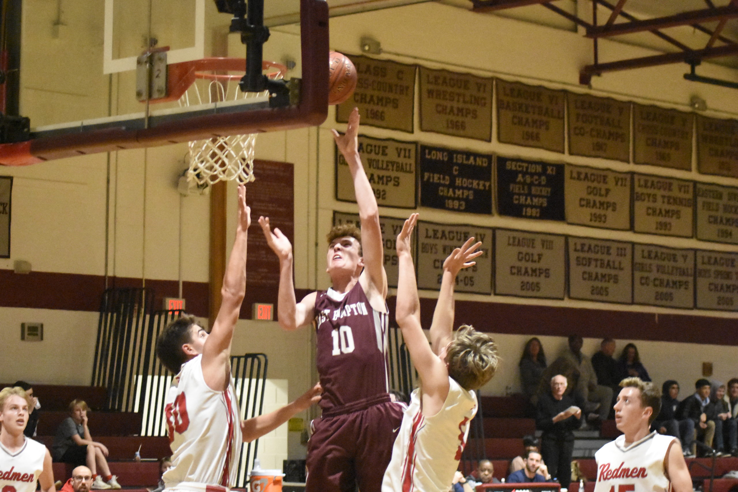 East Hampton's Charlie Condon puts up two points.