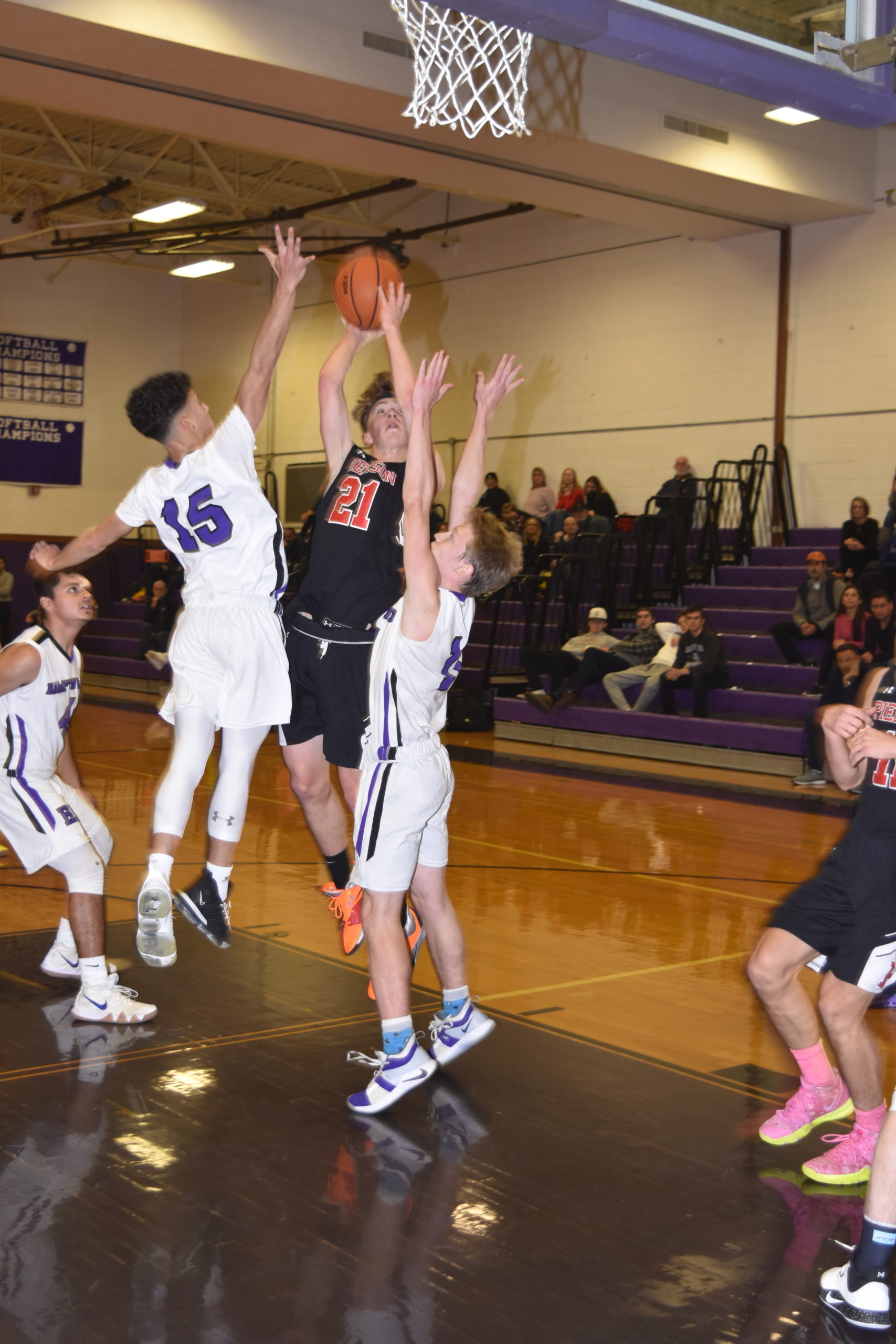 Pierson sophomore Wilson Bennett goes up and over Baymen Lucas Brown and Steven Mora for a basket.