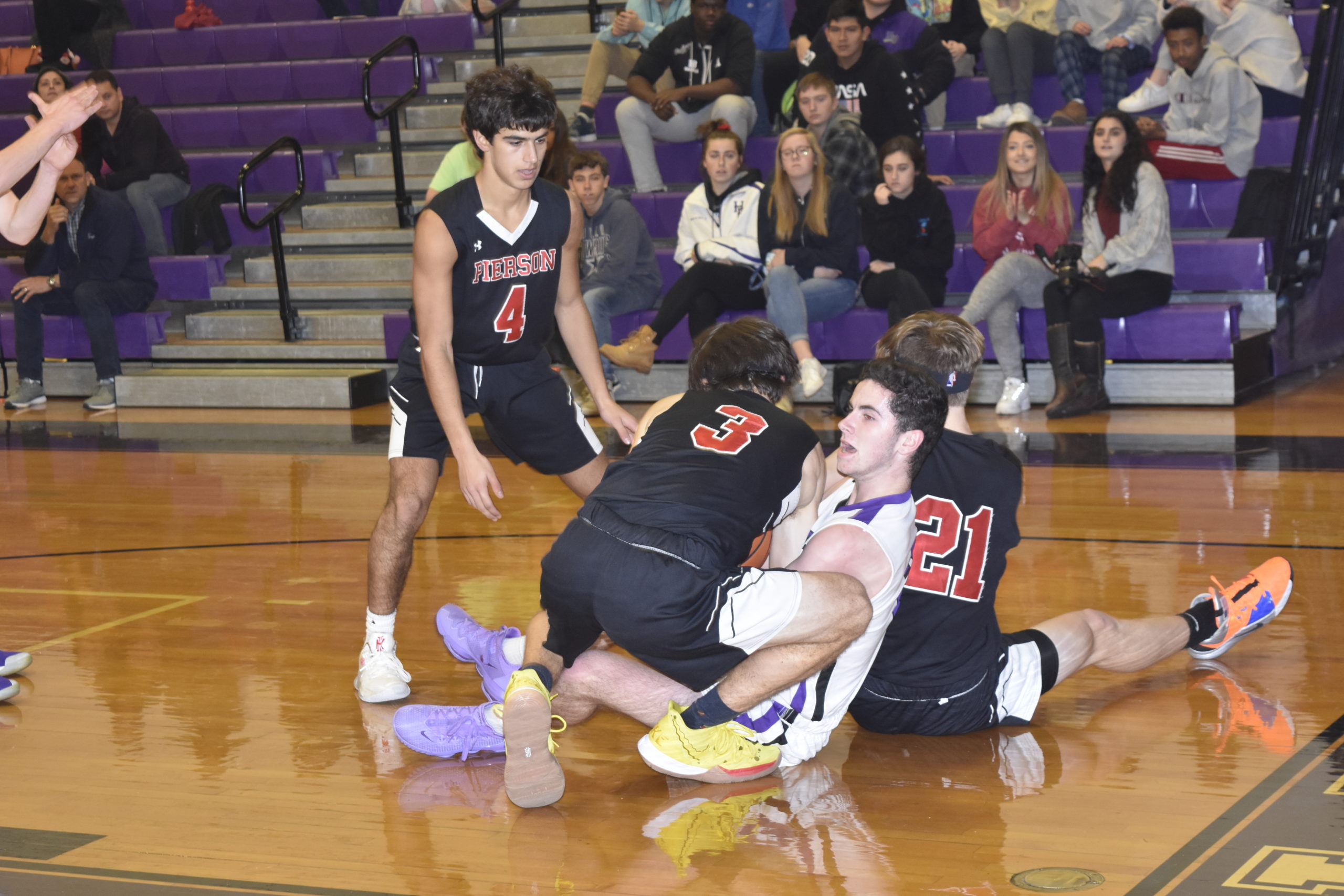 Whalers Henry Brooks (3), Wilson Bennett (21) and Peter Schaefer converge on Bayman Jaden Ottati for a loose ball.