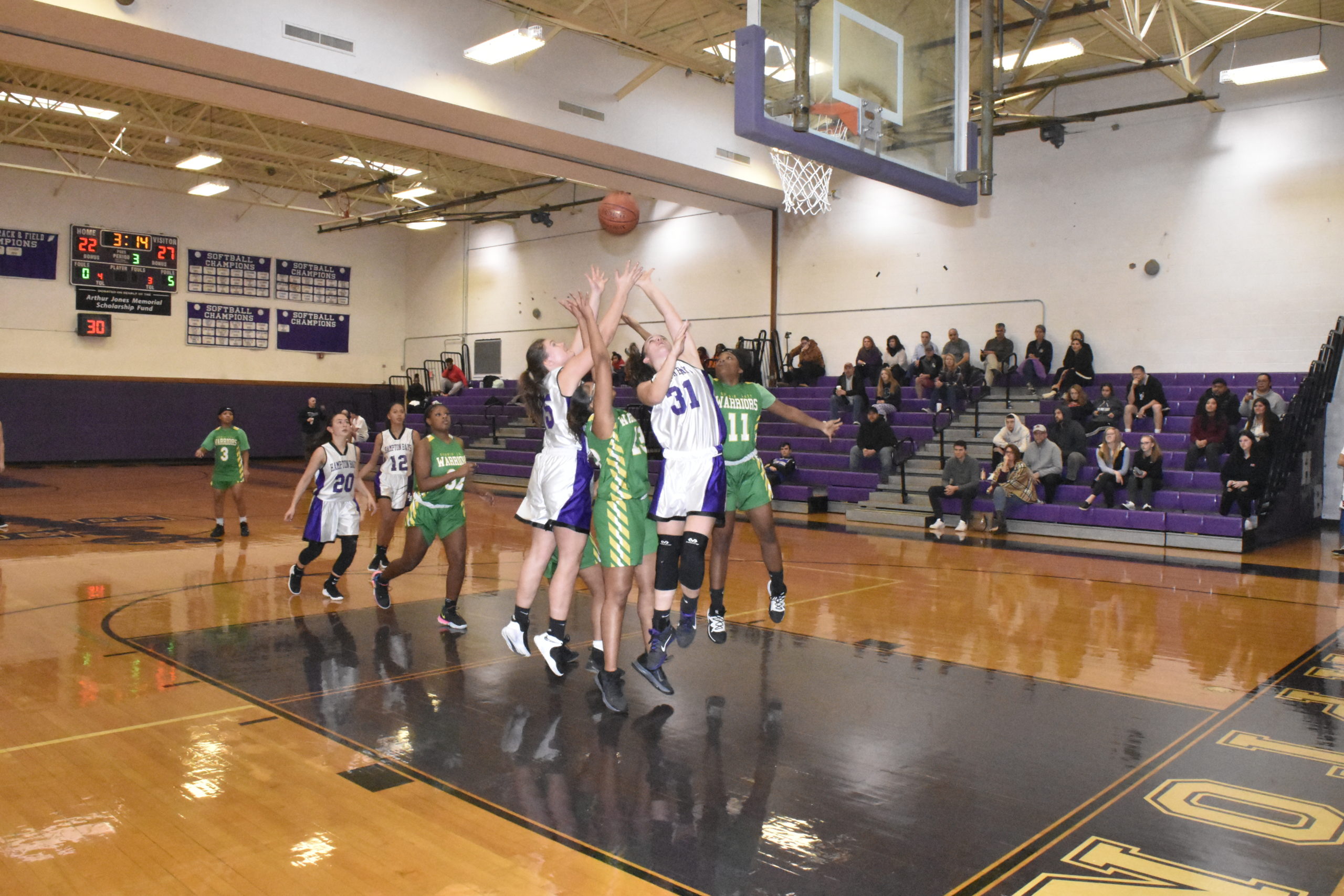 Lady Baymen Kaitlyn Mounts and Lily Candelaria try and get a long rebound.