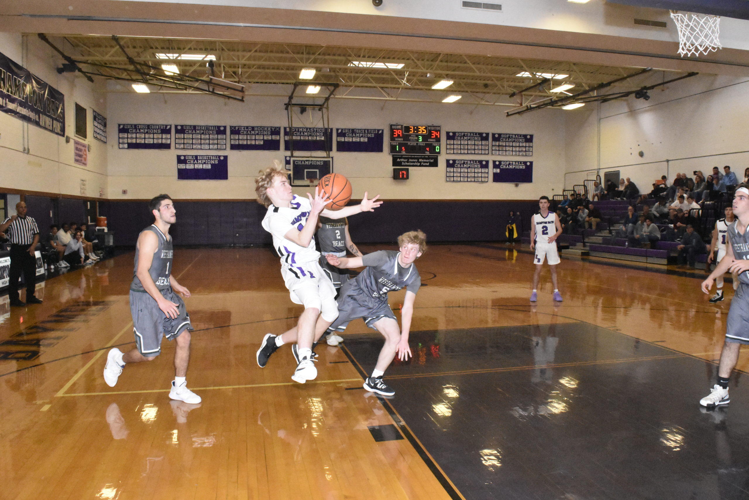 Hampton Bays junior Jack McNamara draws a foul. He made all 20 of his free throws in the triple overtime victory on Saturday.