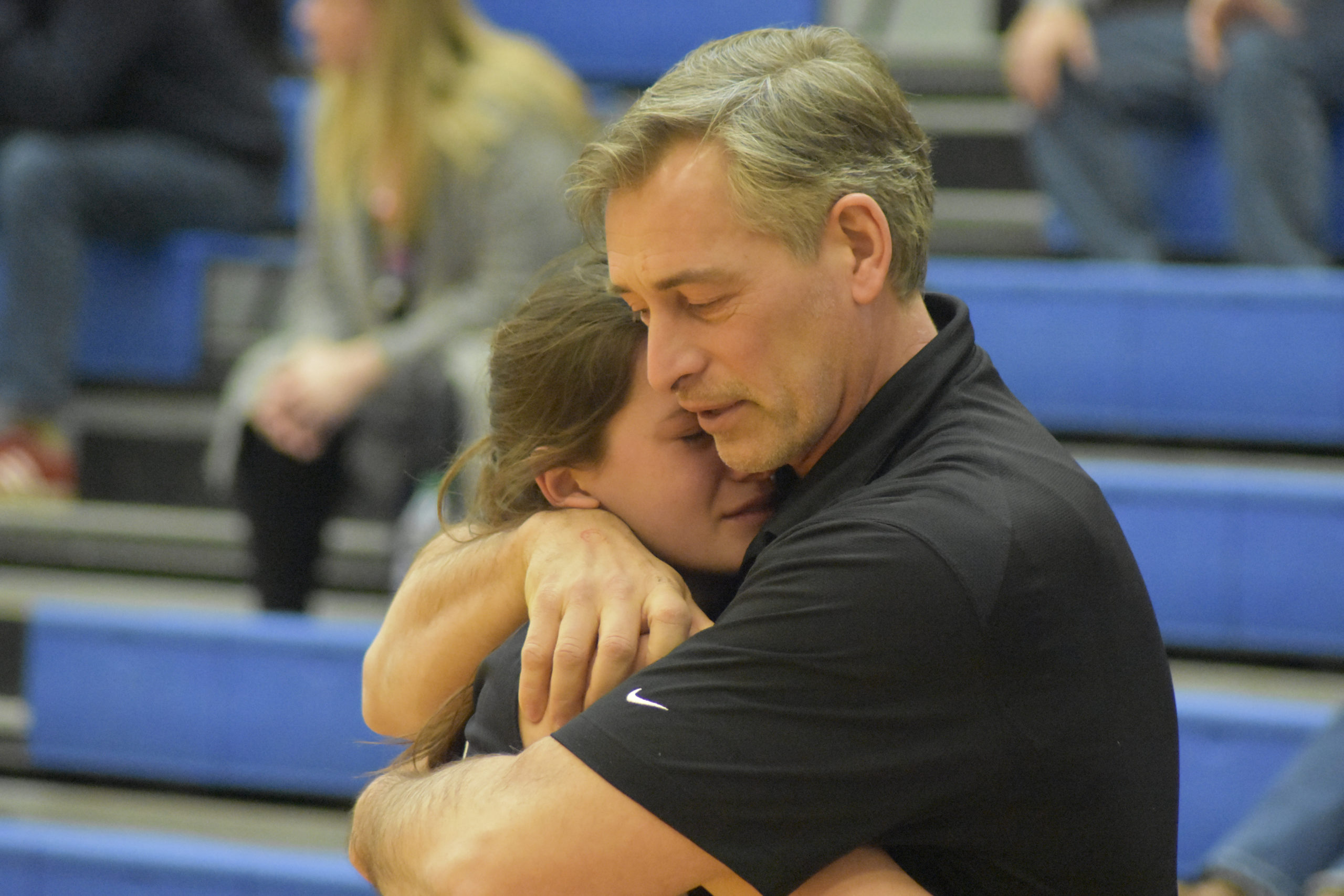 Emotional End For Lady Whalers 
March 14 -- The Pierson/Bridgehampton girls basketball team lost to Millbrook in the Regional Final at SUNY New Paltz. The Lady Whalers won the county title. George Kneeland is hugging his daughter Katie Kneeland as she walks off the court for the last time.