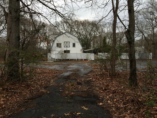 The site of a proposed car wash in Wainscott has been blighted for nearly 10 years following the demise of a nightclub that once operated there. LAURA WEIR
