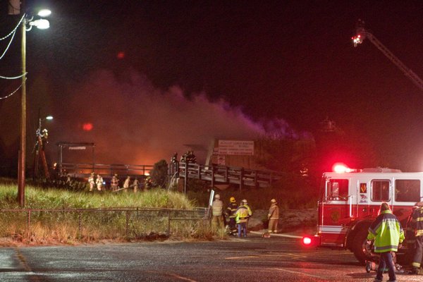 Several fire departments responded to a fire at the Cupsogue Beach Hut in Westhampton Saturday night. Neil Salvaggio